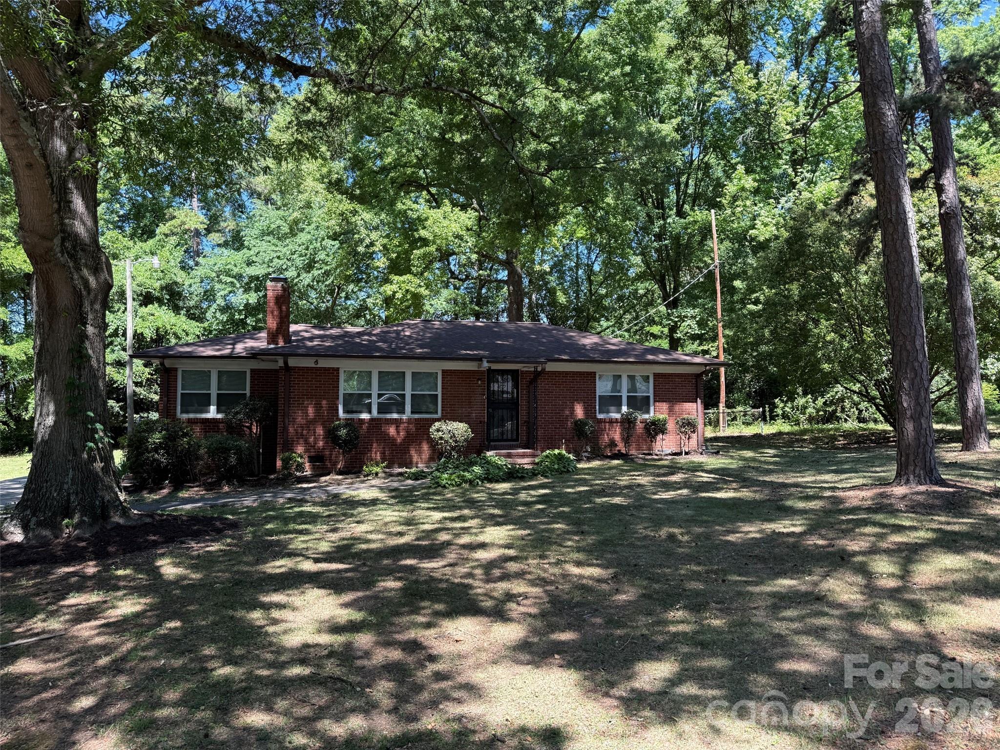 Welcome to this beautifully remodeled 3-bedroom, 2-bath brick home where timeless character meets modern comfort. Nestled on an oversized, shaded lot with incredible potential for an ADU, this property offers flexibility, style, and space both inside and out.

Step inside to discover a bright open-concept floorplan designed for easy living and entertaining. Refinished hardwood floors add warmth and elegance throughout the main living spaces, while luxury vinyl plank and tile flooring provide durability and style — with absolutely no carpet anywhere in the home.

The stunning new kitchen is the heart of the home, featuring:

Gorgeous quartz countertops
Large center island with seating
Brand-new cabinetry
All new stainless steel appliances
Modern finishes and abundant workspace

The primary suite has a new bathroom and offers a fresh, contemporary feel, while the versatile third bedroom includes its own private side entrance — making it the ideal home office, guest suite, studio, or flex space.

Outside, the oversized lot is surrounded by mature trees that provide exceptional shade and natural beauty, helping keep the home especially cool and inviting year-round. With ample room for an accessory dwelling unit (ADU), workshop, garden oasis, or expanded outdoor living, the possibilities are endless.