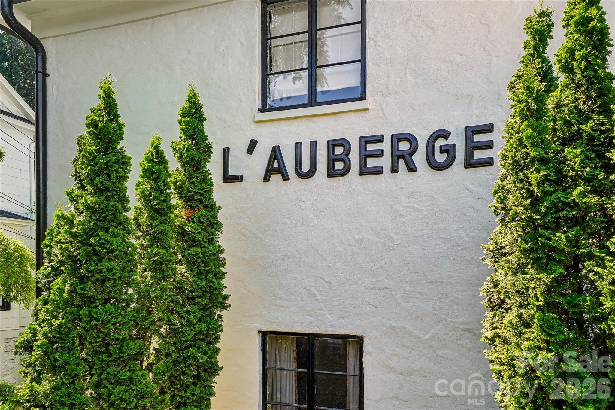 Newer renovation condo located in the coveted L’Auberge condominiums in Tryon, NC. It is rare that units come up for sale in this stylish, historic building located downtown and right across the way from the Tryon Fine Arts Center and the Lanier Library. Featuring 9 ft ceilings and newer appliances and fixtures, this sweet home is nicely appointed with luxury vinyl planking throughout and granite countertops in the kitchen. Natural light and exposed brick are highlights of the living room area and there is plenty of storage in the walk-in closet and bathroom as well. This condo would be perfect as an investment or an easy place to live full time. Your HOA dues cover water, sewer, electric, trash pickup, and exterior upkeep! An eclectic and welcoming town, Tryon has much to offer residents and visitors alike. Come claim your piece of this historic offering in the Foothills of North Carolina.

PLEASE NOTE: while drive-bys are welcome, please do not park int he gravel parking area in front of the building.