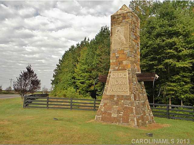 Frontage is lined with Purple Plum trees and black equestrian style fence that continues down road. Enjoy your privacy, as all lots are a minimum of 5 acres. Take a drive and enjoy the beautiful historic countryside and only 5 minutes from Lake Wylie.