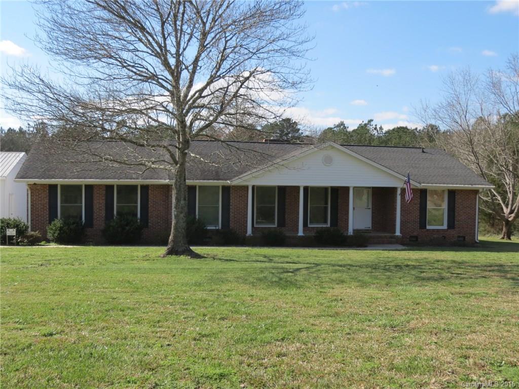 Very nice brick ranch with a very open feel.  This home has 3 bedrooms and 2 full baths.  The large family room with a fire place is centrally located in the home.  The home has new paint and is move in ready.  The home has an attached garage and also a large 40x32 shop with large bay doors.  The backyard is private and surrounded by woods.  This home sits on 1 acre of land and is very convenient to I-77 and shopping.