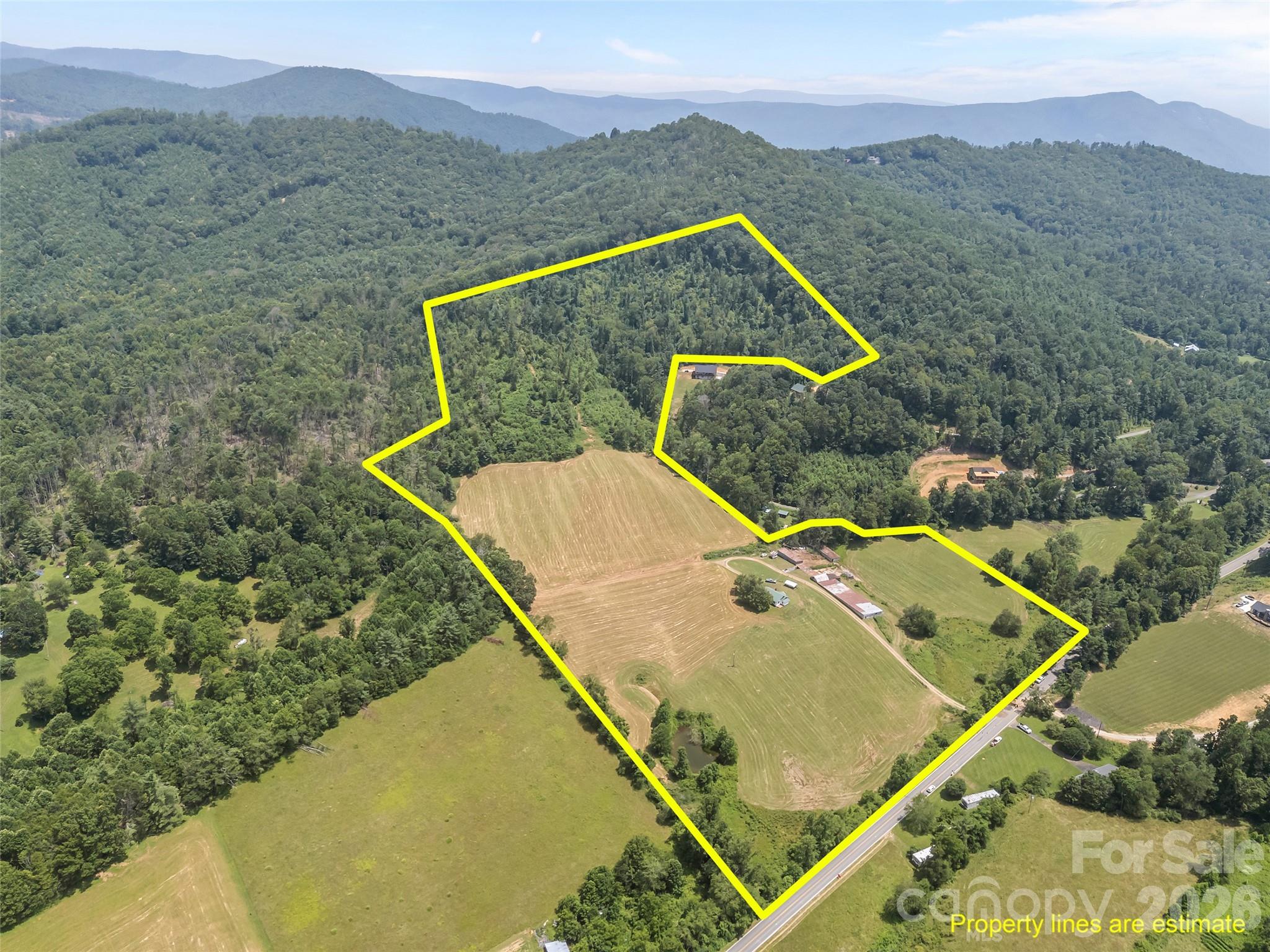 Imagine owning a piece of history with this rare 5th generation farm offering 47+ unrestricted acres in the heart of Western North Carolina. The land is a mix of open fields, wooded areas, and gentle slopes with stunning mountain views. There are multiple water sources and long- range views from nearly every point on the property. Land to develop multiple homes or cabins, create a private mountain estate, start a working farm for livestock or crops, or build a retreat or campground. The property includes a very clean 1,028 sq ft home—move-in ready or perfect as a guest house or rental. Centrally located between Asheville/Hickory/Boone offering privacy and easy access to town amenities. Ideal for homesteaders, developers, or anyone looking to invest in usable mountain land with history, beauty, and potential. Rare opportunity—properties like this don’t come around often. Schedule your showing today.