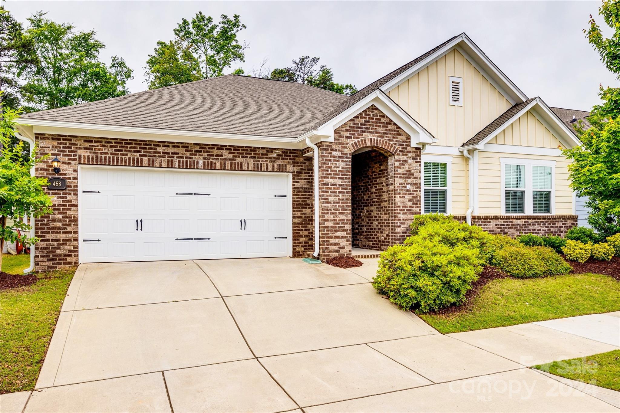 Stunning and hard to find 1-STORY, open floor plan home, is TURN KEY and located in the highly sought after neighborhood of MASSEY in Fort Mill, SC. This 3 bed 2 bath home + flex room greets you with its wide entry and hallway that takes you to the stunning chef's kitchen, featuring: gas cooktop, electric oven, soft-close cabinetry, high ceilings, and grande island that comfortably fits 4+ chairs. The living room is beautifully spacious and cozy with its GAS FIREPLACE and updated trim-work! Just off the living room is the primary suite with vaulted ceiling, custom batten board, and looks out to the backyard LINED WITH TREES for an extra privacy factor! The sizeable primary bath has a large walk-in shower and closet. The other two bedrooms are on the opposite end of the home and share a full bath. You will also find a 4th room with french doors that can be used as an office or flex space! Enjoy the backyard that is lined by trees, paver patio, and covered back porch. This home is a gem!