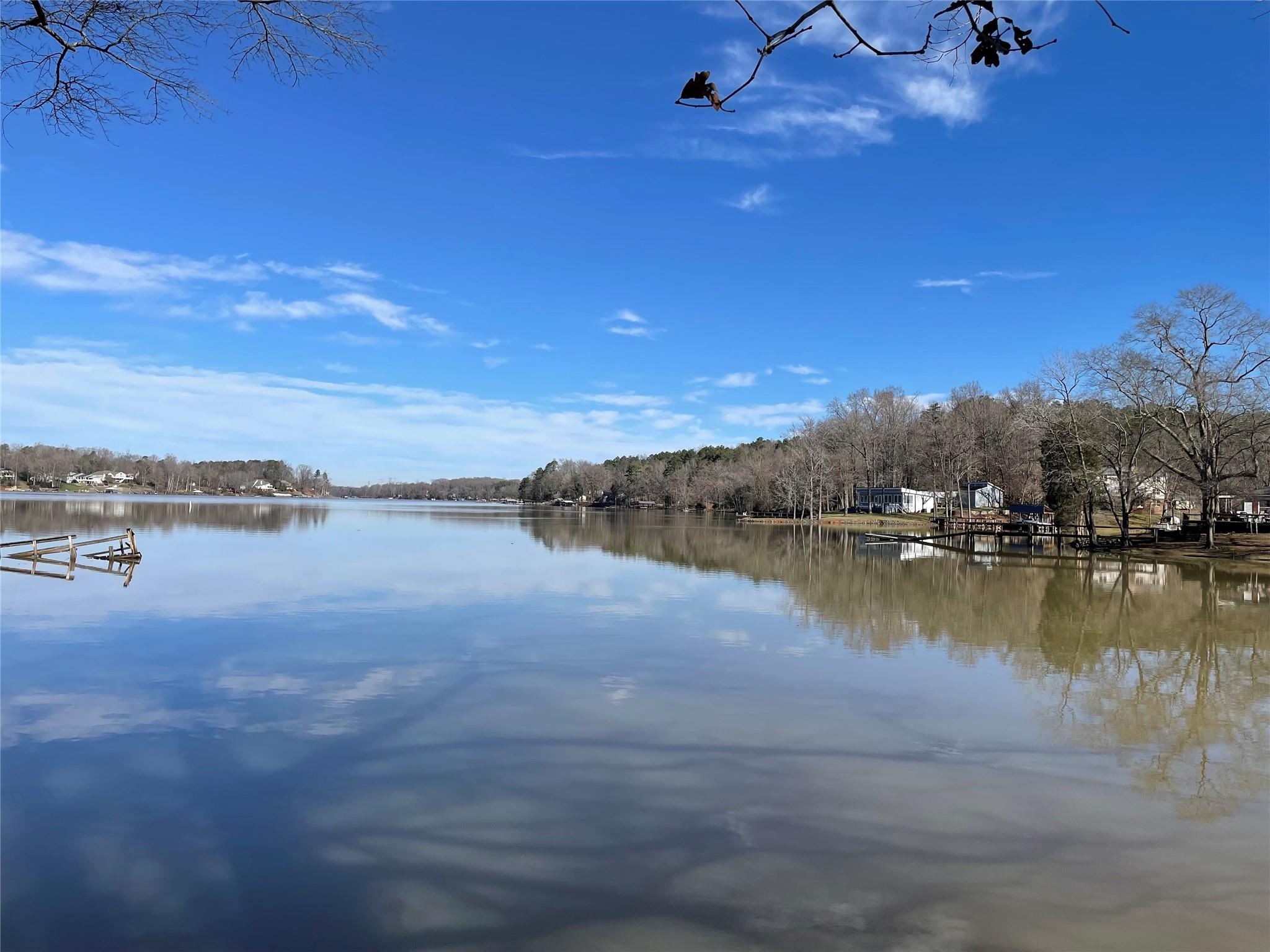 Private, Lake Wylie waterfront homesite ready for you to build your dream!  1.26 acre wooded lot with no Hoa dues!  Located on a protected and peaceful cove with open views perfect for fishing, swimming, and boating.  A few hundred yards to access to the Airline Mountain Bike Park and Mecklenburg County Park Trails.  Get away from it all, yet live close to shopping, dining, Uptown Charlotte, airport, and The River District!