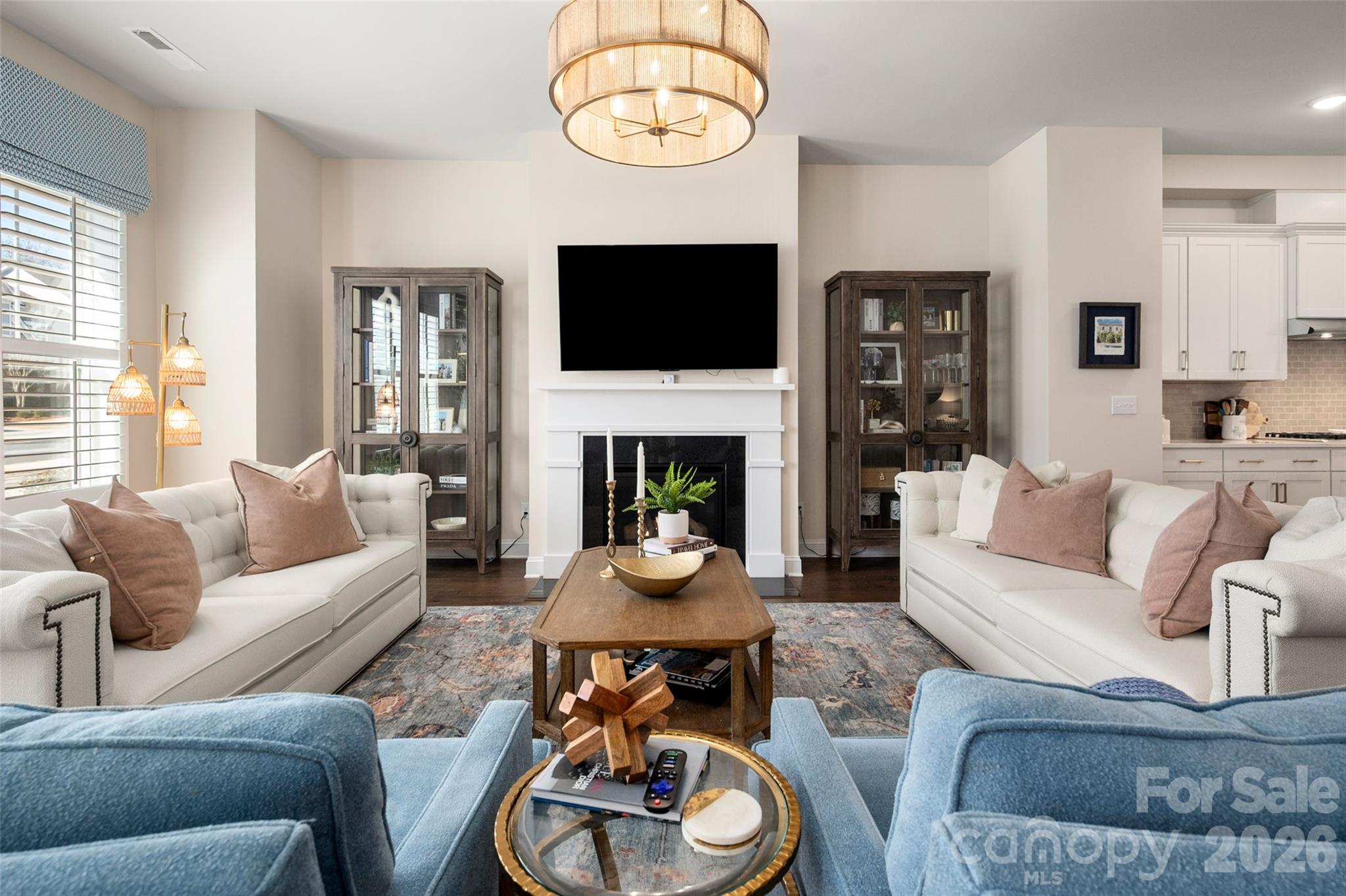 Enjoy easy living in the heart of Ballantyne! With very little maintenance, this townhome leaves you more time to have fun and enjoy all that the Ballantyne area has to offer. You will fall in love right as you walk through the front door.  The current owners have made extensive updates to the home including new kitchen and bathroom countertops, plantation shutters, an additional 50 gallon water heater, new Bosch dishwasher, hardwood on stairs, fresh paint throughout the home including an accent wall in primary bedroom, California closets in the primary bedroom and kitchen pantry, new wallpaper in the primary bathroom, sitting room, and downstairs powder room, plus upgraded light fixtures in kitchen, bathrooms and dining area!  Enjoy morning coffee or wind down in the evenings on the private, enclosed patio.  There is a 2 car garage for parking convenience!  The HOA maintains the lawns with weekly mowings along with shrub trimming and pine needles twice a year.  Easy access to 485, Morrison YMCA, highly rated neighborhood schools and The Ballantyne Bowl.