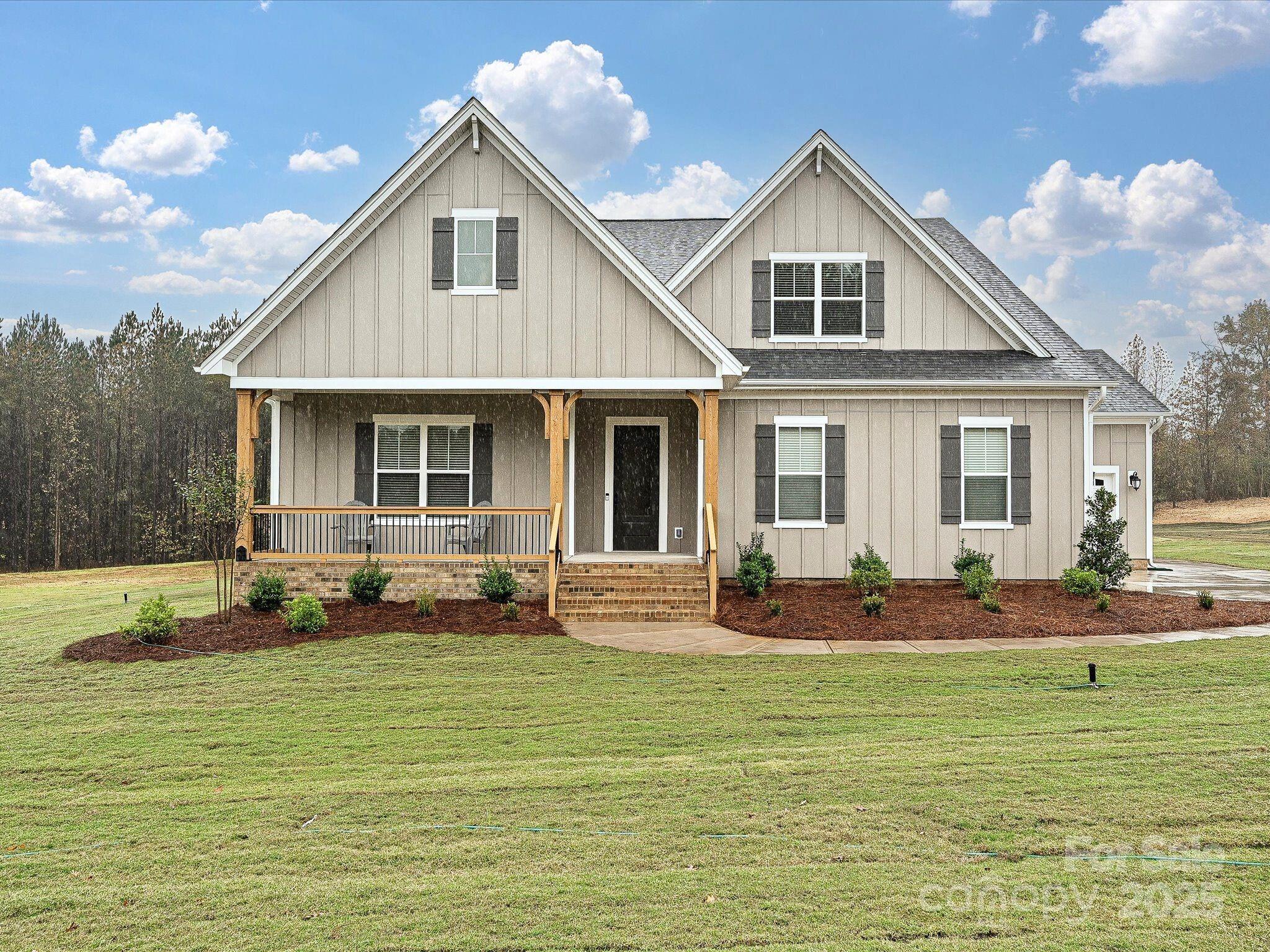 Move-In Ready Newer Construction Home on flat 1 acre lot that backs to a wooded buffer. Built in 2024, this 1.5-home offers an Open floor plan that brings the Outdoors in. The kitchen, dining & family rooms are perfect for entertaining. The kitchen boasts floor-to-ceiling cabinets, an oversized island w/quartz countertops, double ovens, gas cooktop w/SS hood & large walk-in pantry. The Family Room w/gas shiplap fireplace opens to the covered back porch through sliding doors. The owner's suite features a vaulted ceiling, giving it an airy open feeling, and also has access to the covered back porch. The Owner’s Bath has two walk-in closets, a large double-sink vanity, a luxury walk-in shower w/rain shower & hand-held shower heads. The Upstairs retreat adds a 4th BR and 3rd Full Bath, plus a large bonus room that is plumbed to & ready for you to add a wet bar.  The 3-car garage provides plenty of extra storage space.  Conveniently located close to Clover Middle School & downtown Clover