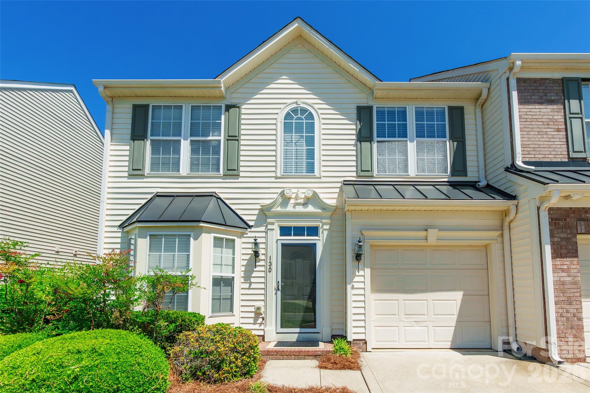 Welcome to this beautifully maintained 3-bedroom, 2.5-bath end-unit home offering comfort, space, and thoughtful updates throughout. This home is filled with an abundance of natural light, this home features vaulted and tray ceilings that enhance the open, airy feel.

The main level includes a spacious primary suite and a convenient laundry area, along with stylish Luxury Vinyl Plank flooring installed in 2026 and fresh paint throughout the entire downstairs. The kitchen is well-appointed with Corian countertops, a gas range and oven, and flows seamlessly into the living space highlighted by cozy gas logs.

Upstairs, you’ll find generously sized secondary bedrooms, walk-in closets, and a huge open loft with banister railing—perfect for a second living area, office, or play space. Storage is no issue with a double walk-in attic plus an additional pull-down attic with flooring.

Step outside to a partially fenced patio offering privacy and a great space to relax or entertain. Additional features include a single attached garage, bay window, and a home that has been professionally cleaned and well cared for.

Community amenities include a pool, playground, and boat storage, all in a prime location just minutes from shopping, dining, and convenient access to Charlotte, NC.

Seller is offering a $500 carpet allowance for the primary bedroom; all other carpet is in great condition. Washer and dryer (installed November 2024; washer used once, dryer never used) will convey with acceptable offer.