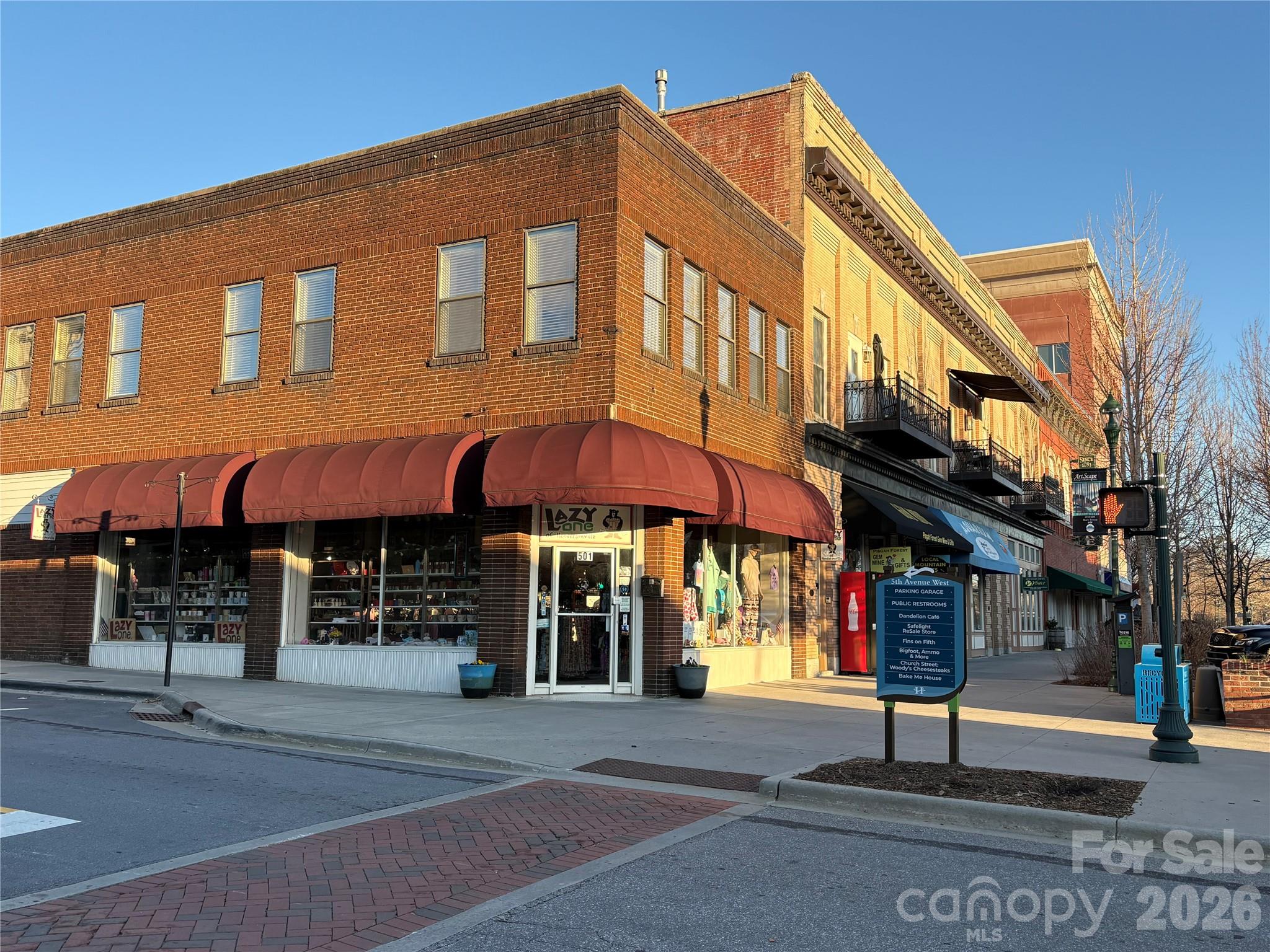 This unique property has everything! 

Over 9,000 sf of space on Main Street, Downtown Hendersonville. The 3,000 sf+ first floor has retail space in the heart of the city, on Main Street with the constant foot traffic of locals shopping and dining, and hundreds of thousands of tourists visiting each apple season. Behind that, there are offices with three entrances just off of 5th Avenue. This space can be configured to accommodate one large or a few small businesses. The top floor has three move in ready apartments and there is over 3,000 sf of unfinished basement. 

Current retail tenants are on a month to month lease, the apartments and office space are vacant.