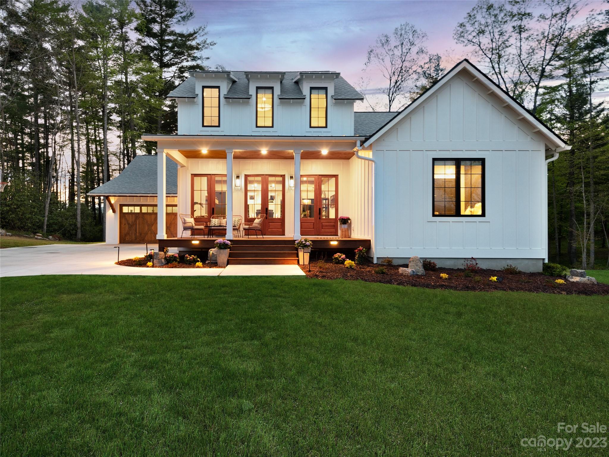 LOCATION! OPULENCE! VIEWS! This modern, luxury, farmhouse style home has the most spectacular mountain views and vibrant sunrises. Situated on 2.64 acres overlooking the prestigious Cane Creek Valley, it's truly a rare gem. This newly built home has unparalleled craftsmanship and intentional design. The 10ft ceilings and huge windows boasts tons of natural light. The gorgeous kitchen features professional Frigidaire appliances, gas stove, large island, and quartz countertops. The open floor plan was created for entertaining while capturing the stunning views. The spacious primary bedroom & bathroom comes complete with a custom walk-in closet, his & hers sinks, glass shower & free-standing soaking tub. Thoughtfulness went into every inch of this elegant 5 bedroom, 4 bath home. The oversized 2 car garage, 2 living areas, wet bar, & home gym provide room for all your favorite hobbies. Sip a drink on one of the covered porches or at the nearby Turgua brewery and soak up the mountain charm.