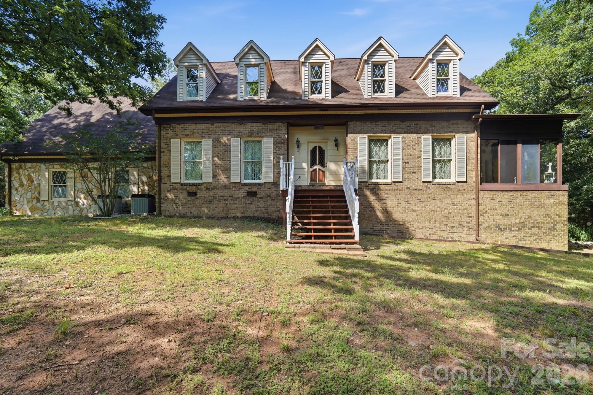 ACREAGE, PRIVACY & ROOM TO GROW - 11.26 acres with a brick home PLUS a separate 5.66-acre vacant parcel, sold together as one rare package! The 4-bedroom, 2.5-bath home offers 2,700 sq ft of comfortable, move-in-ready living space with hardwood floors, a cozy fireplace and attached garage. Downstairs, the partially finished walkout basement - complete with finished walls, drop ceiling and a dedicated workshop - adds flexible space for hobbies, storage, or future finished living area. Outside, enjoy a private, picturesque setting of mature woods and open cleared areas perfect for farming, gardens, animals or play, plus an outbuilding for equipment and storage. The adjoining vacant parcel opens the door to endless possibilities: build a second home for family, hold as an investment, or simply enjoy the added privacy and elbow room. Country living at its best with low county taxes, yet just minutes to charming downtown Mount Pleasant, an easy drive to Concord and Charlotte, and close to Albemarle and the Uwharries. Land like this - with a well-kept home already in place - rarely comes available. Schedule your private tour today!