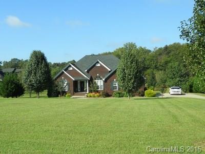 Back on Market - Buyer Qualification Problem - Beautiful Full Brick Home with High Ceilings in the Entry, Great Room and Dining Room.  Front corner bedroom has a cathedral ceiling.  All wood flooring except for bathrooms & laundry. Granite Kitchen Countertops. Master Bedroom has a trey ceiling and large walk in closet. Master Bath has a soaking tub and separate shower and double vanity. Rear two level deck that overlooks a beautiful rear yard. Garage interior is finished.