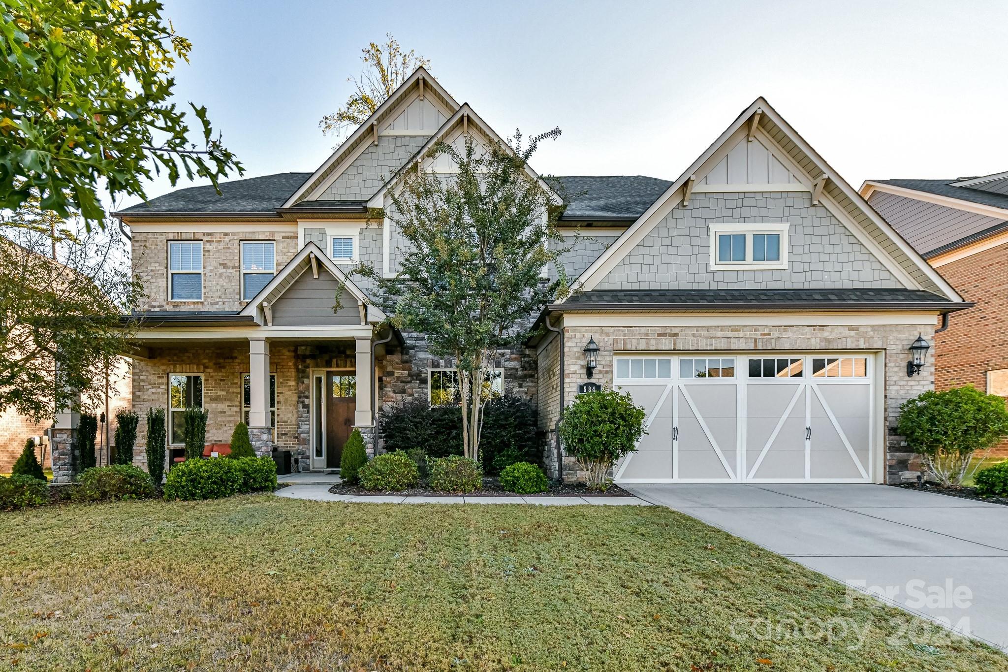 This luxurious brick home in Indian Land is a stunning example of Pulte Homes' craftsmanship. This beautifully designed 3-story home offers 5 BRs, w/ the possibility of a 6th BR/Bonus, making it perfect for those who need flexible living spaces. The spacious layout includes a 3rd story recreation room w/a convenient half bath, contributing to a total of 4.5 baths. There is a main level guest ensuite. The open design floor plan itself is designed with a blend of functionality and luxury, featuring open-concept living spaces, main level guest ensuite & coffered ceilings. Want to entertain? Look no further than the gourmet kitchen w/gas range oven, microwave/ wall oven combo & an amazing pantry. The expansive owner's ensuite has all the appointments you would expect in this beautiful home. The 3rd story rec room is where the fun begins & is perfect for a theatre room. Pricing reflects some needed floor repairs. Community fun; Outdoor pool, cabana, & playground. Easy access to I-77/I-485.