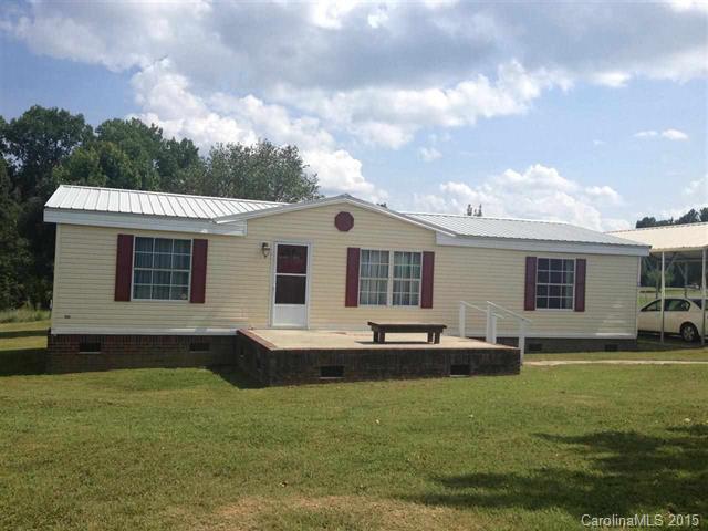 MOVE IN READY! Open and airy 3 bedroom 2 bath home in the country!  Large yard with fruit trees NEW HVAC water heater, carpet flooring and carport...