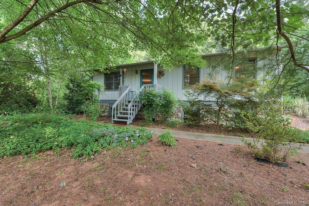 Affordable home in a popular neighborhood close to Lake Junaluska & Waynesville! Priced below the current average sales price in the county, this home offers a big bang for the buck. Sitting on a private, landscaped, fenced lot the home has a special charm. Home features pine floors in the living room & kitchen, functional kitchen with breakfast bar, & 3 bedrooms on the main level. Full basement with over 200 sq ft finished room & 1 car garage. Back deck offers private outdoor area to relax!
