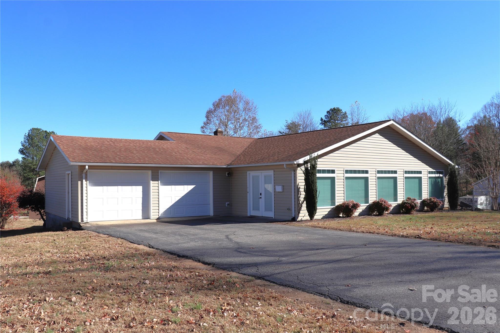 Ranch style home with a double garage and basement on over an acre, located just off Hwy 321 behind Walmart Hudson Market. The property features a two-story building with approximately 3,500 SF, and an additional 14' X 44' block building with metal roof. The buildings on this property are a contractor's dream for a workshop and storage! The home features a beautiful kitchen with custom cabinets, granite counter tops, eat-at island and built-in desk. Included appliances are electric range, built-in microwave, refrigerator, dishwasher, washer and dryer on the main level. The large dining room overlooks the back of the property and boasts a spacious walk-in pantry. The sunroom has lots of natural light, a separate mini-split unit, and leads to a fenced side area. The main bedroom features an impressive custom designed walk-in closet. The bedrooms share a hall bath. (The 3rd bedroom does not have a closet.) The main level laundry room is located off the walk-in closet and hall bath. The unfinished basement has a washer/dryer hookup and bathroom with tub/shower. Home/property is being sold As Is.