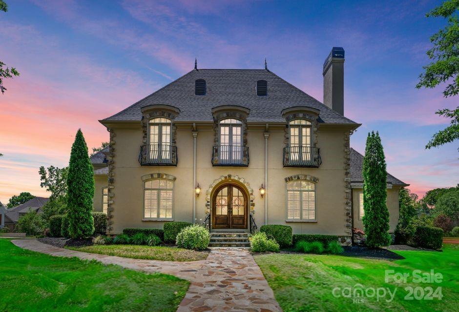 PRICE IMPROVEMENT!! Absolutely stunning, exquisite French country style 4BR home that epitomizes luxury living. Walking through the front door you are greeted with elegance in a coffered ceiling living room, gigantic dining room.  7 1/2” wide hardwood flooring planks throughout entire downstairs and on landing of second floor. Stunning chef's kitchen, 4cm thick leathered Bianca Andes marble, Double-Oven, Gas Stove and expansive island. Large master suite on the main. Upstairs has over-sized bonus, and 3 large BRs each with their own full bath. Step outside into your private oasis. New 26X48 salt-water pool with 5 bubblers and 2 waterfalls, 10-person spa (2023), wood burning fireplace (2024), Tennesse Flagstone (walkways, driveway, pool, and patio - 2023), new outdoor lighting (2022), new rear gutters (2023) and rear irrigation addition of zones (2023). Whole home painted (2022). Garage updated with refinish of doors, high rise smart garage door motors (2022) and EV charger ready (2023)