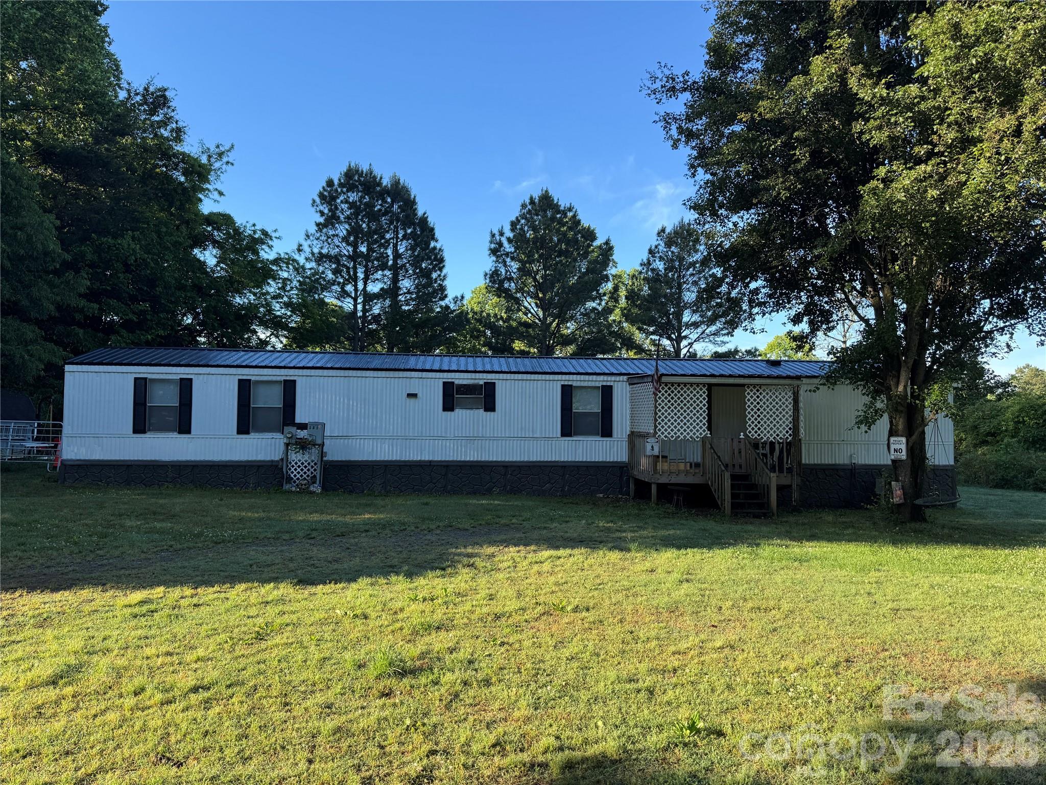 Nestled on just over 5 peaceful acres, this 3-bedroom, 2-bath manufactured home offers the perfect blend of privacy, convenience, and potential. Whether you're looking for room to spread out, start a mini homestead, or invest in a rental property with acreage, this property delivers endless possibilities. Enjoy the freedom of being outside city limits while still only minutes from I-77, shopping, dining, and everyday conveniences. A storage shed with electricity adds extra functionality for hobbies, storage, or workshop space. Property is being sold AS-IS.