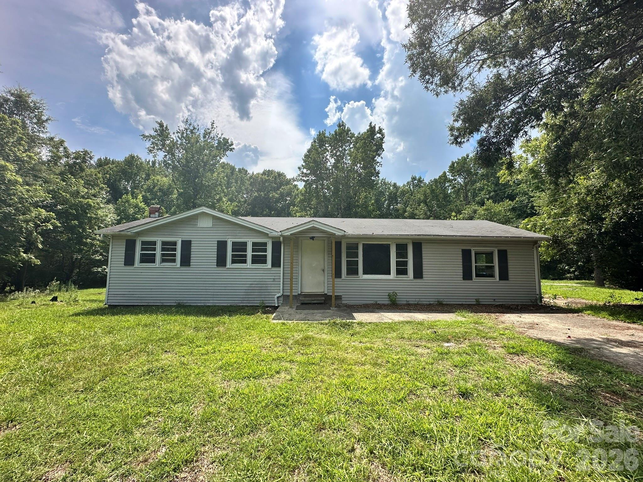 Opportunity awaits on this 1.00-acre homesite in Weddington. The existing vinyl-sided ranch offers 1,213 square feet with 3 bedrooms, a separate office/flex room, and two bathrooms, plus a rear deck. Served by Union Power with private well and septic; no HOA. An excellent opportunity to renovate and build equity, or reimagine the property, in an established, high-demand area. Utilities are currently off.