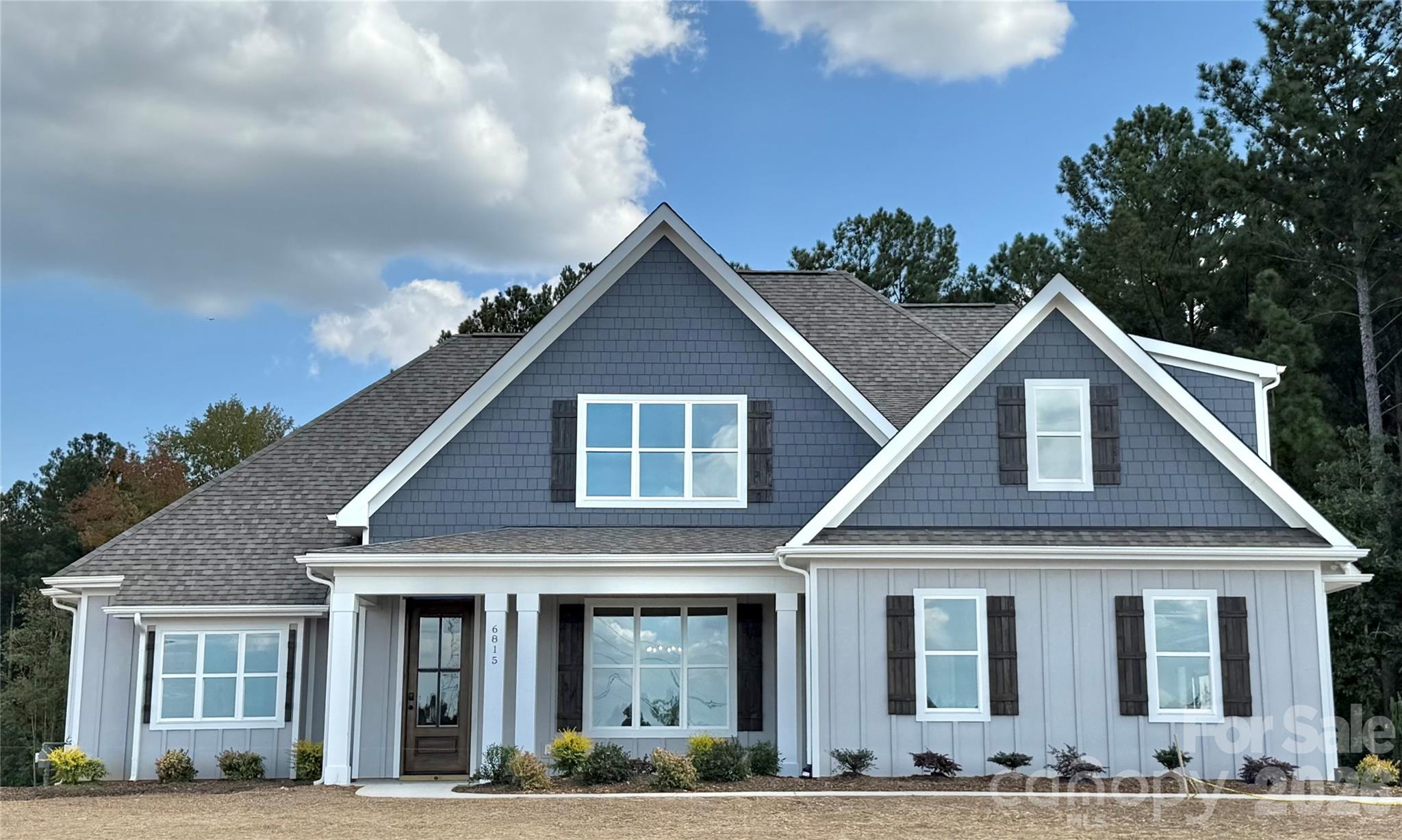 OFFERING $5000 FOR CLOSING OR BUY DOWN.This spacious Waxhaw home offers the perfect blend of comfort, function, and style. The oversized main-floor family room features cozy gas logs with a beautiful wood mantle, the perfect gathering space. The kitchen shines with granite countertops, a large island, abundant storage, and a built-in custom study area, creating a functional and stylish workspace right at the heart of the home. The main level boasts a grand primary suite complete with a walk-in shower, freestanding tub, and a custom-shelved walk-in closet. A second bedroom on the main floor adds flexibility for guests or multi-generational living. Enjoy your morning coffee on the covered front porch or unwind in the evening on the back patio, both designed for relaxed outdoor living. Upstairs, you’ll find two additional bedrooms, a loft overlooking the family room, and a spacious bonus room perfect for a home office, playroom, media room, or guest retreat.
?? Space. Style. Versatility.
This Waxhaw beauty truly has it all. Pictures shown furnished are via AI.