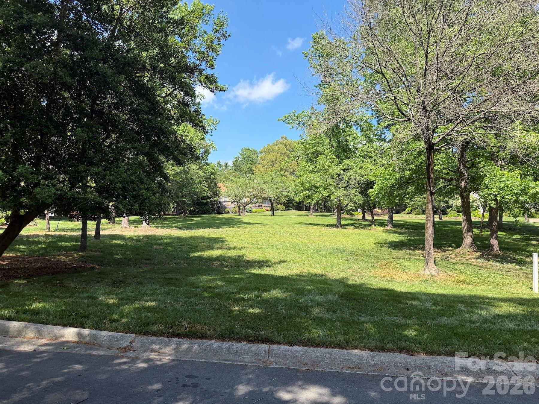Beautiful level homesite in the Millingport neighborhood of Old North State Club's gated community! Build your dream home and enjoy exceptional views & the convenience of the community day dock and community putting green. The lot is an easy walk to Old North State Club amenities. Become a member of the Club for access to its recently renovated championship golf course, dining, pools, tennis/pickleball courts & more.