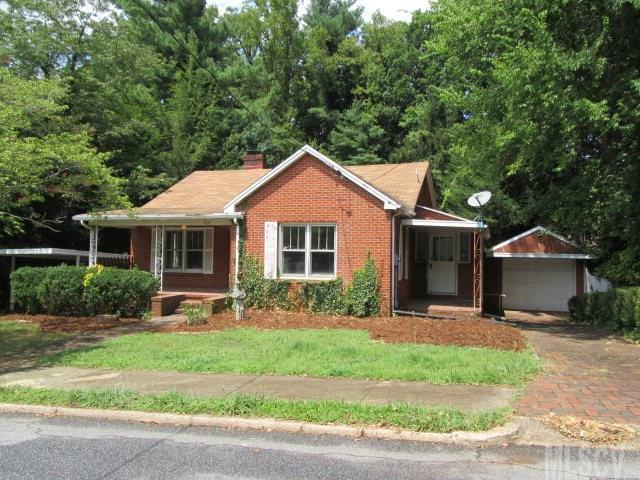 This beautiful brick home has it all: lots of charm, a great location, and best of all, a great price! This 2 bedroom, 1 bath home has a large kitchen with a unique built-in pantry, walk-in closet in the master bedroom, and dazzling hardwood floors that have been newly refinished. The backyard is a lush, private oasis, and the detached garage is complete with a large workshop underneath. The unfinished basement provides lots of additional space and is a blank canvas of possibilities. Just minutes from downtown Morganton, and a short walk from Forest Hill Elementary. Don't miss out on this affordable home in a prime location.