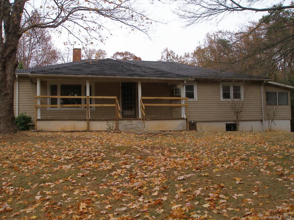 Vinyl sided older home with very private location on no through street on 1.18 acre lot wooded on 2 sides. Covered porch overlooks spacious side yard. Large kitchen, heated enclosed back porch, concrete floored cellar with oil furnace and electric water heater.   Note: stay off the deck as it is unsafe.