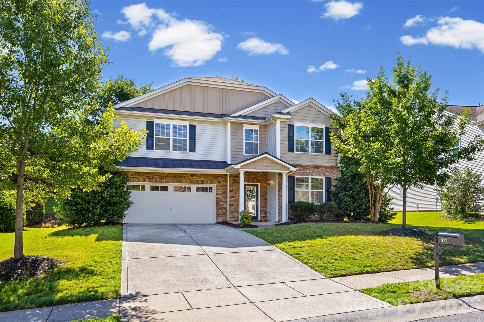 This isn’t just a house. It’s the kind of home that greets you with a deep breath of calm and a spark of excitement every time you walk through the door. Tucked in the heart of the sweet community of Spicewood, this 4-bedroom, 2.5-bath showstopper is full of thoughtful details and effortless charm. Step inside to find sunlit spaces, brand-new luxury vinyl plank flooring and carpet, fresh interior paint throughout the entire home, and a layout that simply flows. Elegant formal living and dining rooms provide the perfect backdrop for holiday gatherings, dinner parties, and everyday entertaining. The heart of the home? A wide-open great room invites everyone to gather around the gas log fireplace, seamlessly connected to an oversized kitchen made for living—think designer-inspired sage-green cabinetry, a classic subway tile backsplash, a large corner pantry, granite counters, an undermount sink, and a microwave. Upstairs, your primary suite feels like a breath of fresh air—spacious, serene, and complete with dual vanities, a soaking tub, a separate shower, and a generous walk-in closet. A spacious loft anchors the second level, creating the perfect gathering space while thoughtfully connecting all of the bedrooms. Even better, every upstairs bedroom features its own walk-in closet, offering abundant storage and space for everyone. Thoughtful updates throughout the home include beautiful new bathroom vanities that feel more like custom furniture pieces, complemented by brushed gold lighting and hardware that add a designer touch. The upstairs laundry adds an easy rhythm to daily life. Step outside, and the magic continues. The back slider takes you to a large yard with a concrete paver patio. With its private setting and spacious yard, this outdoor retreat is made for summer cookouts, relaxing nights by a fire pit, and endless backyard fun. All this, within top-rated Fort Mill County Schools, just minutes from I-77 and I-485 and all the best dining and shopping around!