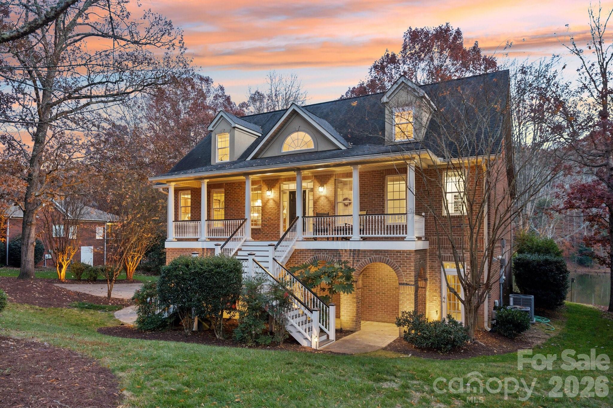 Opportunities like this rarely present themselves in Fort Mill, South Carolina. Welcome to an exceptional waterfront retreat at 131 Spring Branch Road, where privacy, space, and turnkey living come together seamlessly. Set on nearly ¾ of an acre, this home offers far more than just four bedrooms and four bathrooms. Inside, you’ll find everything you expect from a move-in-ready property, including hardwood flooring, new carpet, custom paint, a screened-in porch, and a three-car garage. What truly sets this home apart, however, is its serene waterfront setting and tree-lined privacy, providing a peaceful escape right in your own backyard. Enjoy year-round water access and the tranquility that comes with it. Adding even more value is the rare, permitted basement, already studs-up with plumbing in place, offering space for a living area, full bathroom, and bedroom—ideal for future expansion, guests, or multigenerational living. Homes like this—combining waterfront living, privacy, and expansion potential—are seldom available. Don’t miss your chance to experience it firsthand.