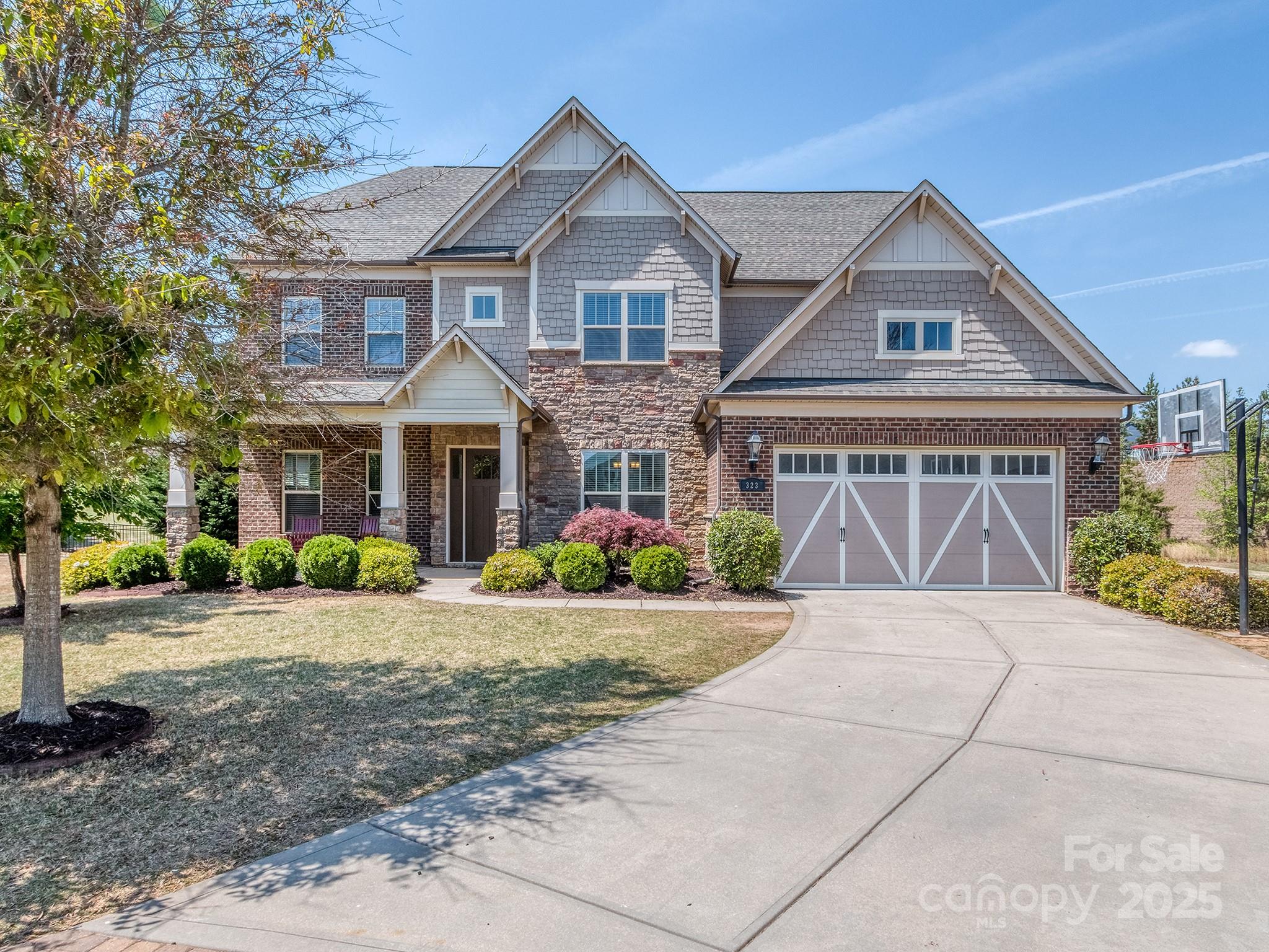 Don't miss this stunning Brick & Stone 5 Bedroom, 4.5 Bath w/ playroom AND 3rd floor loft. Guest Suite ON MAIN!!  Perfectly situated on large cul-de-sac homesite.  Minutes from Ballantyne!!! POOL community!! Upon entry you see the private study with glass French doors and large formal Dining Room. Notice the beautiful hardwoods throughout main living area. Impressive Family Room w/ stunning coffered ceiling and stone gas fireplace flows to open concept gourmet Kitchen with huge island, stainless steel built-in appliances, and walk-in pantry.  Great breakfast area and additional office niche. Upstairs Primary Suite is so spacious!! Ensuite bath features massive double vanity w/ tower, linen cabinet, drop-in tub and tiled shower. Also upstairs...3 more bedrooms and 2 full baths.  Plus a playroom (easily converts to possible 6th Bedroom).  Third floor is a giant loft for entertaining...includes a half bath.  Incredible STORAGE!! Great schools!! Restaurants and shopping everywhere!!!