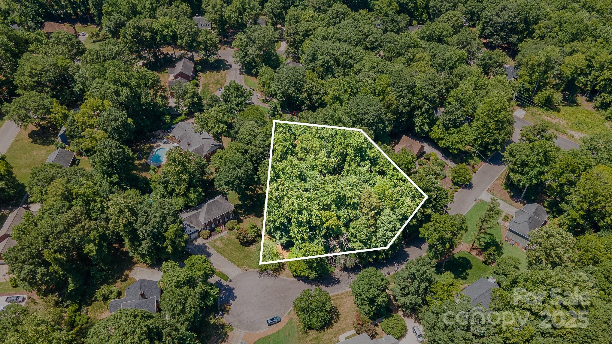 Spacious private cul-de-sac lot in the stately Oakhurst Subdivision. Lot is located off of main street leading you straight into Downtown Rock Hill - convenient to tons of local shops, restaurants & grocery stores. Property has mature trees allowing you to tuck your dream home among the trees for the ideal retreat. Homes surrounding the lot exude southern charm with beautiful curb appeal and friendly peaceful neighbors. Also selling 2729 Tiffany Dr. - the estate next door should you choose to own both parcels!
