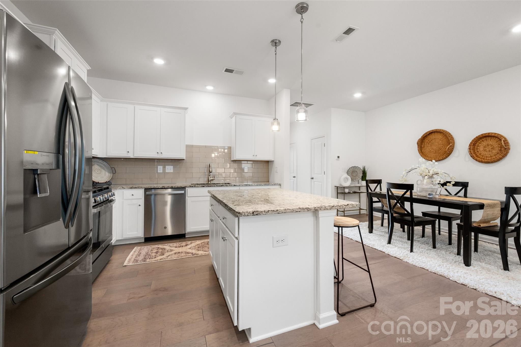 **Back on market through no fault of sellers! Previous buyers' sale fell through.** 

Fantastic opportunity to own a better-than-new townhome in Matthews! The open-concept first-floor layout is ideal for hosting guests and everyday living. A custom, floor-to-ceiling built-in bookshelf in the living room provides exceptional storage. The first-floor half bath is beautifully upgraded with board-and-batten trim and designer wallpaper. The attached 1-car garage includes ceiling-mounted storage shelves, offering excellent organization and maximizing usable space.

Upstairs, the spacious primary suite easily accommodates a sitting area. The primary bathroom features a dual vanity, a walk-in glass-enclosed shower, and flows to a generous walk-in closet. Two additional guest bedrooms are also located on the upper level, one of which includes a custom-installed Murphy bed that allows for multi-purpose, space-saving use. **Murphy bed can be removed at sellers' cost if preferred.

Additional upgrades throughout the home include window shades, updated light fixtures and ceiling fans, fresh paint, and a recently installed storm door.

The sellers love the neighborhood’s walkability and its close proximity to multiple parks and greenways. Harpers Run is conveniently located just minutes from downtown Matthews, I-485, the new Atrium Health Union West, and everyday essentials including groceries, shopping, plus dining in Stallings, Indian Trail, and South Charlotte!