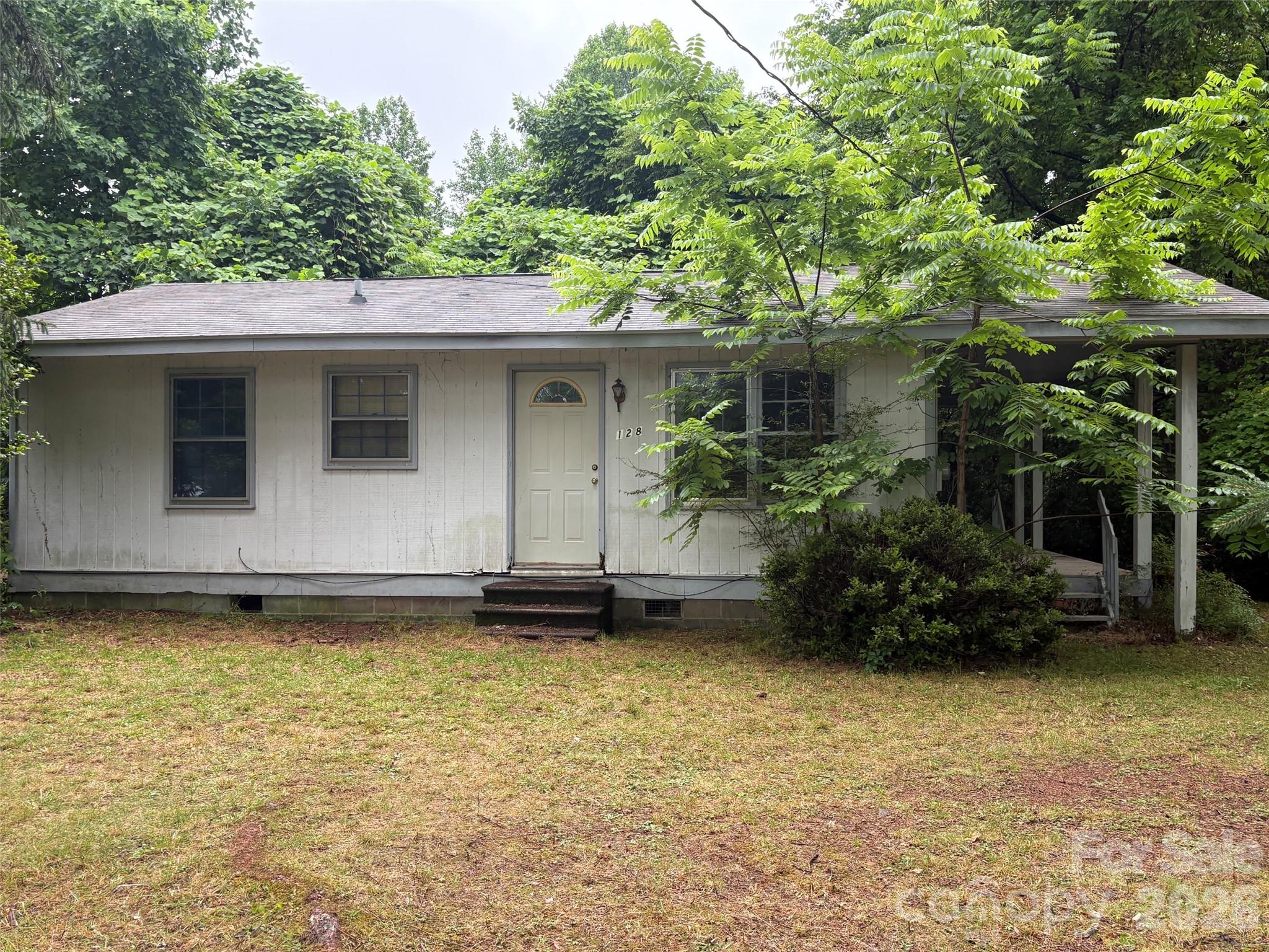 Be sure to notice you will be buying 2 parcels; one has a 2 bedroom/1bath house which needs either an extensive rebuild or a tear down.  There is a 2bd septic and city water and gas hookup.  The second parcel is in the city limits  and allows for at least one new build; possibly 2 homes, which would mean a possibility for 3 homes in total. This property will need a CASH BUYER because of the state of the existing house.  
Any offers submitted will be held and not decided on until June 20th at the seller's request.
Property is being sold "as is".