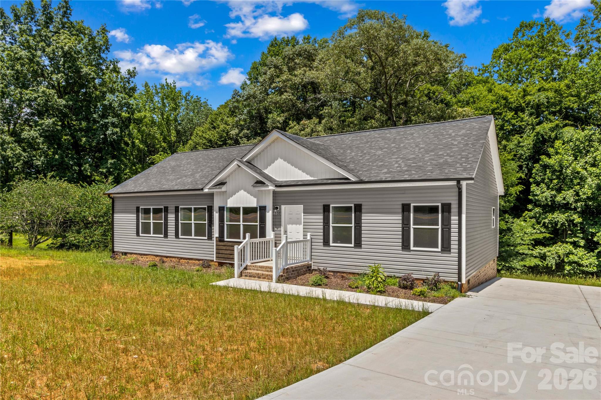This brand new 3 bedroom, 2 bath home offers 1,835 square feet and an open-concept layout designed for comfortable living. The spacious kitchen features a large island, breakfast bar, pantry, and dining area, flowing seamlessly into the living room. The primary suite includes a walk-in closet and private bath. Additional highlights include a dedicated laundry room on the main level, entrance foyer, and modern finishes throughout. Enjoy outdoor living with a welcoming front porch and rear deck, plus a concrete driveway for easy parking. Situated on 1.05 acres, this new construction home also features vinyl siding, a crawl space foundation, heat pump heating and cooling, public water, and septic installed. Plenty of yard space provides opportunities for outdoor activities. Amazing location that is convenient to shopping, dining, and award-winning schools.Lender leasing options available with Stephanie Gates at Top Elite Home Loans.