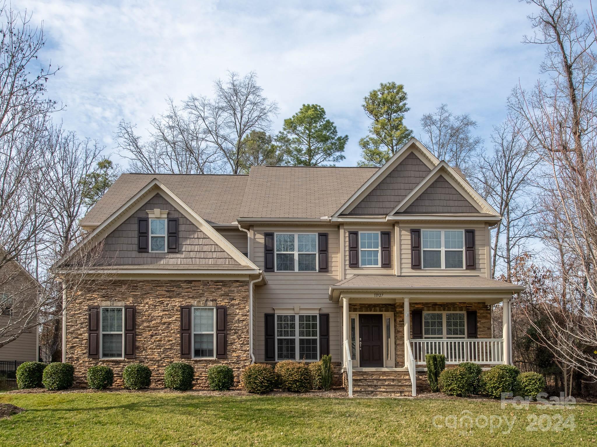 Beautiful home in lake access community. Home freshly painted and LVP through majority of the home! Front porch w/stone surround. Office space w/French doors. Formal dining room or flex space. Spacious family room open to kitchen w/gas log fireplace. Dream Kitchen-white cabinets, induction range, pantry, bar area and pot filler. Drop zone w/tons of storage. Bedroom on main plus a remodeled full bath w/walk in shower. The upper level hosts laundry room w/storage/utility sink. Primary bedroom overlooking wooded yard. Primary bath has luxury walk in shower and dual sinks. 3 add'l bedrooms plus bonus room. Wooded rear yard-custom retaining wall, deck and paver patio. Aluminum fencing. Whole house generator and air purification. Garage loft storage. Community lakeside pavilion w/fireplace, launch your kayak/canoe. Front and rear irrigation. Close to Birkdale Village shopping, restaurants and easy access to everything in between! Quick access to everything Charlotte has to offer. A true Gem!