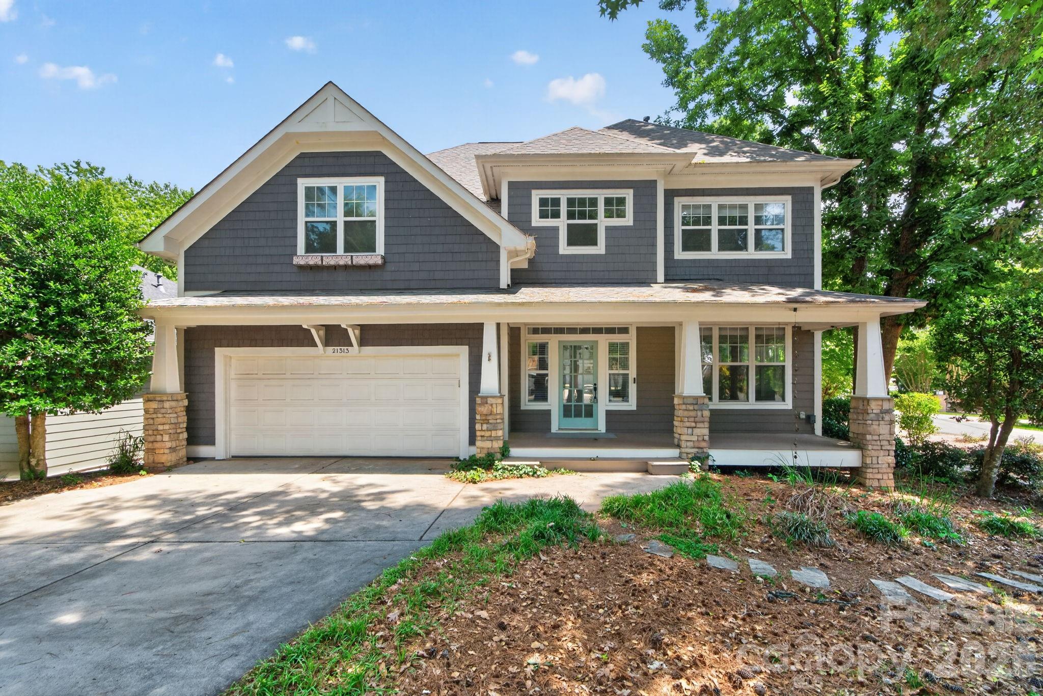 Back on market! Second chance opportunity! Open House 6/27 11AM-4PM, and 6/28 2-4PM. 
Nestled in the heart of Lake Norman, this beautifully updated Craftsman-style home offers water views and spacious living, plus you're zoned for top-rated schools. Thoughtfully renovated with modern upgrades throughout, the home blends timeless charm with exceptional functionality. The fully renovated kitchen features quartz countertops, an oversized stainless sink with upgraded faucet, white oak cabinetry, soft-close drawers, walk-in pantry, stylish backsplash, reverse osmosis water filtration connected to the refrigerator, new gas stove, and an oversized island with seating for six. A stunning 100-inch kitchen window overlooks the private backyard. New engineered hardwood flooring and fresh interior paint complete the interior updates. The great room features vaulted ceilings, wall-to-wall windows, abundant natural light, and a gas fireplace. A main-level bedroom or flex space with nearby full bath offers ideal guest, office, or multi-generational living options. Upstairs, the primary suite includes vaulted ceilings, a walk-in closet, and a fully renovated spa-inspired bath with a freestanding soaking tub and walk-in shower with modern tile finishes. Two additional bedrooms share a Jack-and-Jill bath, while a fourth bedroom or office includes custom built-ins. A spacious bonus room and screened porch offer beautiful Lake Norman views. Outdoor living is designed for entertaining with a deck, outdoor stone fireplace, two screened porches, raised garden beds, stepping stones, and professionally enhanced landscaping with lavender, trees, and azaleas (2024), and in-ground irrigation. Additional parking provides space for guests or a boat, and the private backyard is surrounded by mature trees. Additional features include a new roof (2024) and Nest thermostat. Located near Lake Norman, this home offers easy access to boating, outdoor recreation, and nearby Charlotte. Residents of Island Forest enjoy HOA lake access and a community boat launch area, making it easy to embrace the very best of lake life. The neighborhood is surrounded by premier dining, boutique shopping, local breweries, and year-round events that make the Lake Norman area one of the region’s most sought-after destinations. Don’t miss this exceptional opportunity - schedule your private tour today!