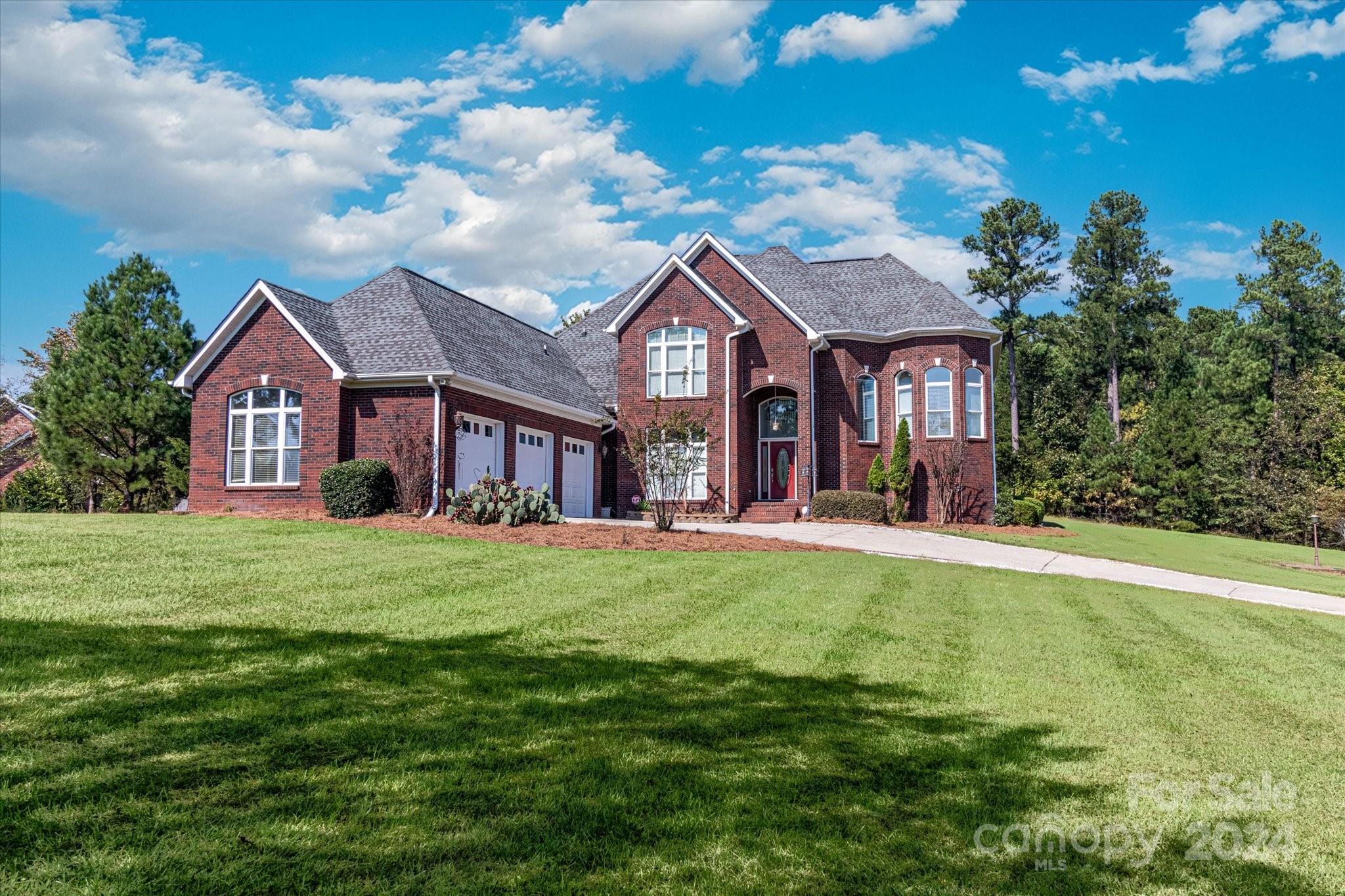 Welcome to this stunning full brick home, an exquisite blend of elegance & comfort, boasting 3,519 SF of thoughtfully designed living space. Nestled on a large corner lot, this residence features a spacious 3-car garage, providing ample room for vehicles & storage. As you enter, you’re greeted by a grand foyer that opens into a breathtaking two-story great room, where soaring ceilings and abundant natural light create an inviting atmosphere. The space flow seamlessly connects the great room to a gourmet kitchen, perfect for entertaining & family gatherings. The luxurious owner’s suite is on the main level, offering a private retreat with a walk-in closet and a spa-like ensuite bathroom complete with dual vanities, a soaking tub, and a separate shower. Upstairs, you’ll find additional bedrooms and versatile living spaces, perfect for guests or a growing family. This beautiful home combines modern amenities with classic charm, making it the perfect haven for creating lasting memories.