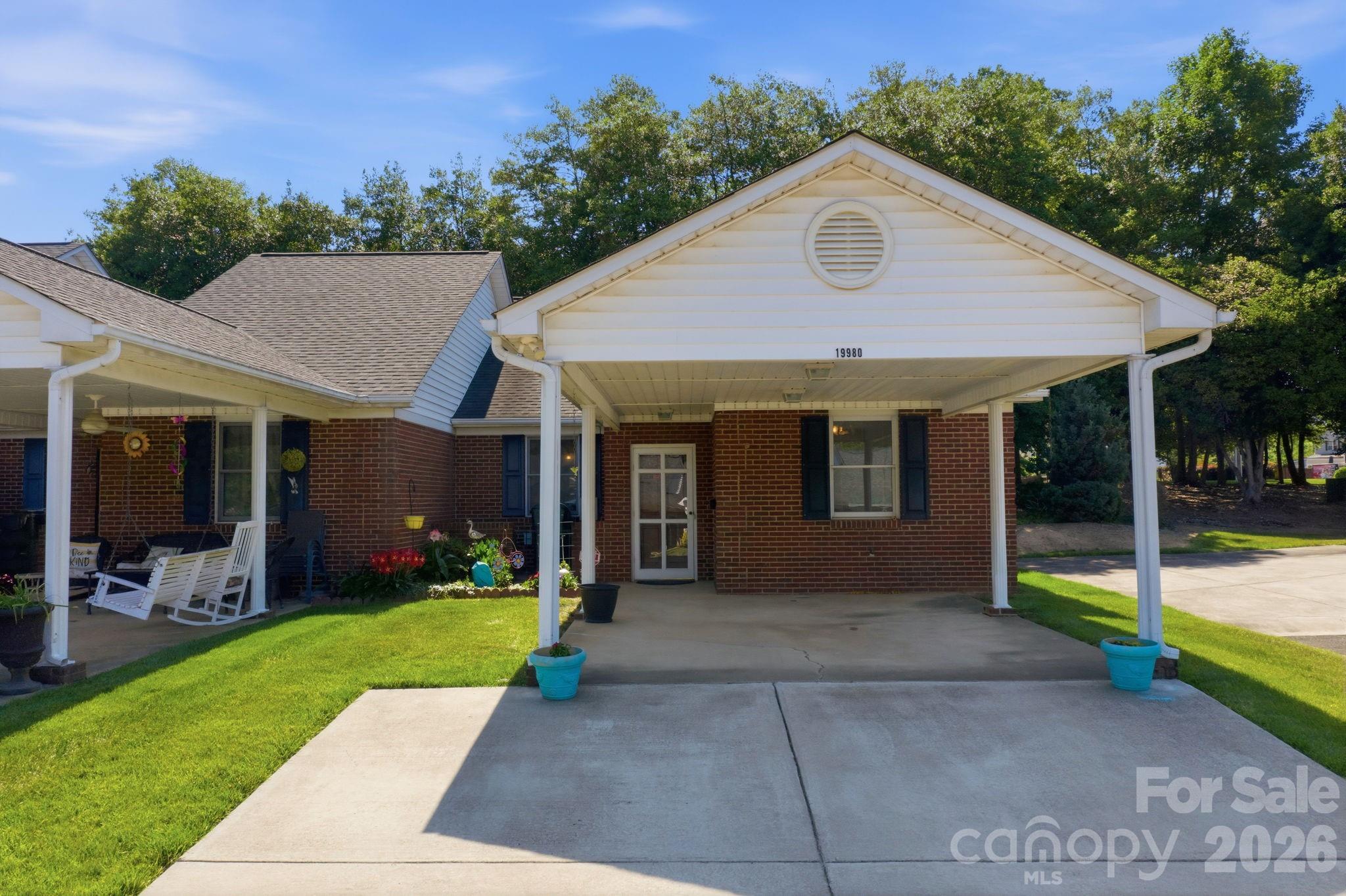 Welcome to Comfort and Tranquility in this sought after 55+ Community.  Fantastic End unit with 2 Bedrooms and 2 Full baths.  Updated flooring invites you into this beautiful home.  Vaulted ceilings bring depth and that feeling of extra space.  The back screened in porch is abundant in shade and relaxation.  Walk around the community on the sidewalk that leads to a community pond.  Lawn maintenance, water, pool, and clubhouse are all included.  Minutes from Lake Norman and shopping.