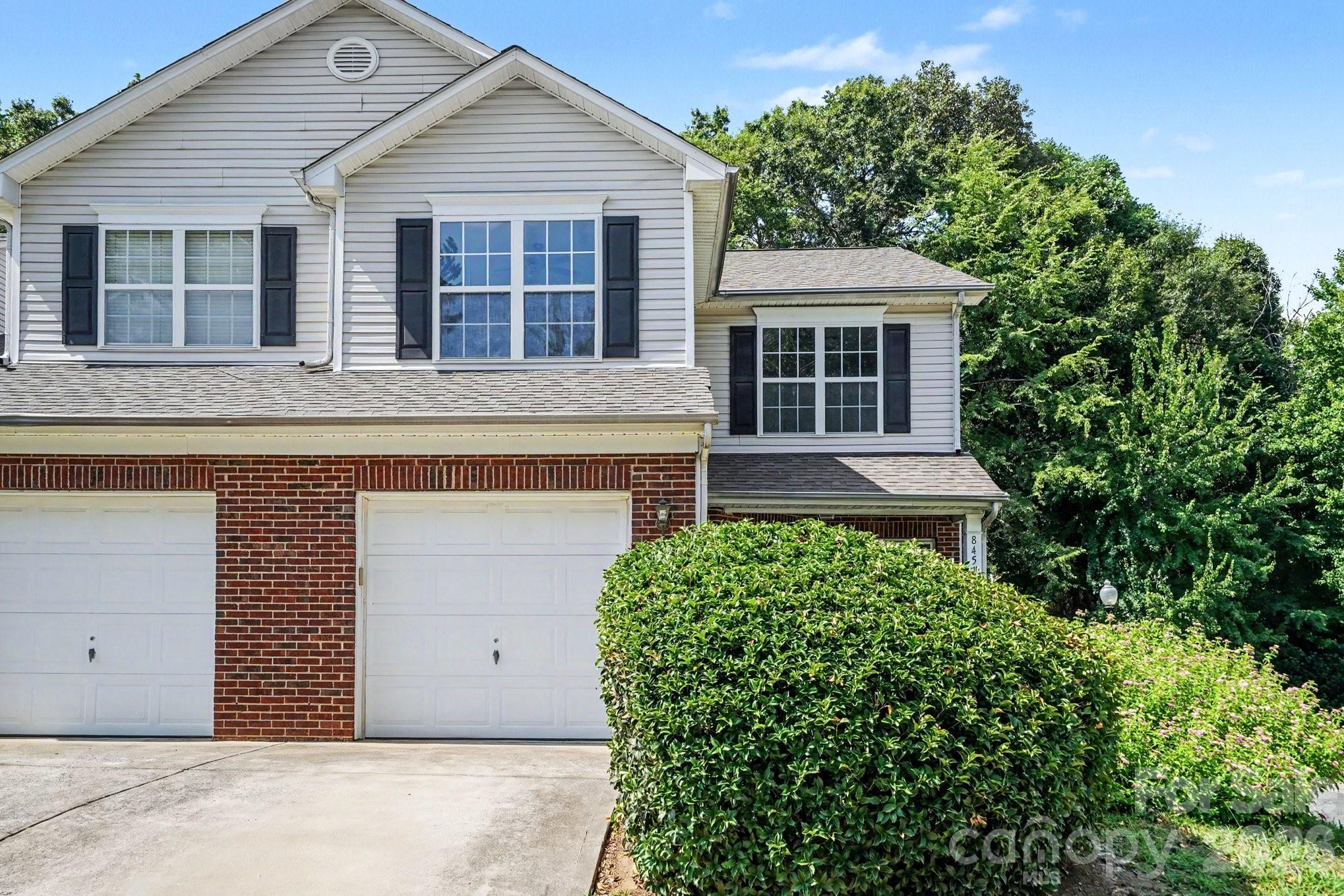 Welcome home to this charming 2-bedroom townhome in the heart of Charlotte! Featuring a great open floorplan, this home offers a spacious and inviting living area centered around a cozy fireplace, creating the perfect space for relaxing or entertaining. The functional layout flows seamlessly into the dining area and kitchen, making everyday living a breeze. Both bedrooms are generously sized, offering comfort and flexibility for family, guests, or a home office. Step outside to the private back patio, an ideal spot to enjoy your morning coffee, unwind after a long day, or entertain friends. A one-car garage provides added convenience and extra storage. Conveniently located close to shopping, dining, entertainment, and major highways, this townhome offers easy access to everything Charlotte has to offer. Whether you're a first-time buyer, looking to downsize, or searching for a low-maintenance lifestyle, this home is full of potential and ready for its next owner!
