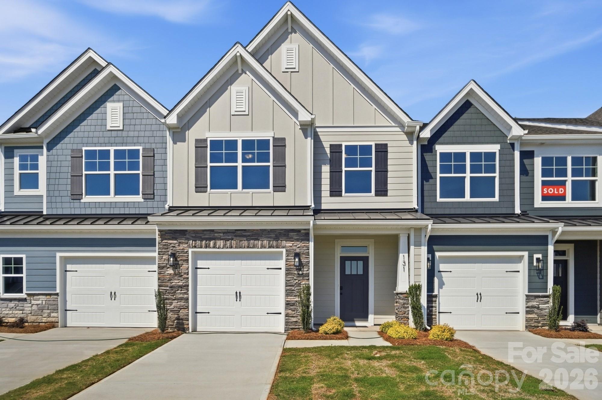 This Ashland plan has 3 bedrooms, 2.5 baths, and more than 1,800 square feet of living space. Enter the home through the foyer with tray ceiling, Craftsman-style trim, and a convenient, beadboard drop zone to see the open kitchen, dining area and family room that walks out to a covered porch. The kitchen features white, Shaker-style cabinets and white quartz counters, a spacious island, white tile backsplash, and stainless appliances, including a gas range. The open main floor has beautiful and durable Enhanced Vinyl Plank flooring throughout. Stairs with composite treads and metal balusters lead upstairs to the loft, bedrooms, full baths and laundry room. The primary bath has a tiled shower with bench seat, dual-sink vanity, and linen closet. The upstairs full bath has a tub/shower combo. Walking distance to shops, eateries, and other conveniences. Visit today!