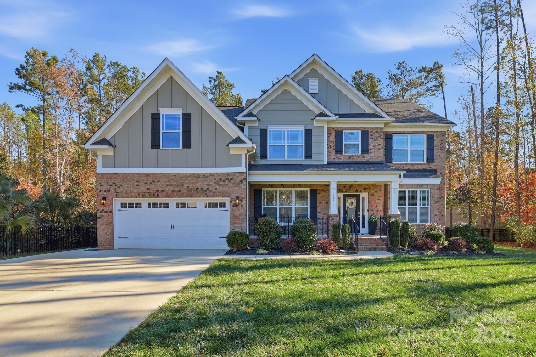 Stunning brick home in The Bluffs! Enjoy the private setting at the end of a cul-de-sac with a long driveway, manicured lawn, and level wooded lot. Relax on the inviting front porch with your morning coffee. Inside, the open floor plan features an office, dining room, great room, mudroom, full guest suite, and a chef’s kitchen with tall cabinets, granite counters, stainless steel appliances, and a large island. Gorgeous wood floors, custom trim, and upgraded lighting add warmth and style throughout the main level. Upstairs offers three spacious bedrooms, a bonus room, two full bathrooms, luxurious primary suite with two walk in closets, a beautifully appointed bath and walk in closets for all the bedrooms. The private backyard is perfect for entertaining with a large deck and lower patio. All located within award-winning schools! Schedule your showings today!