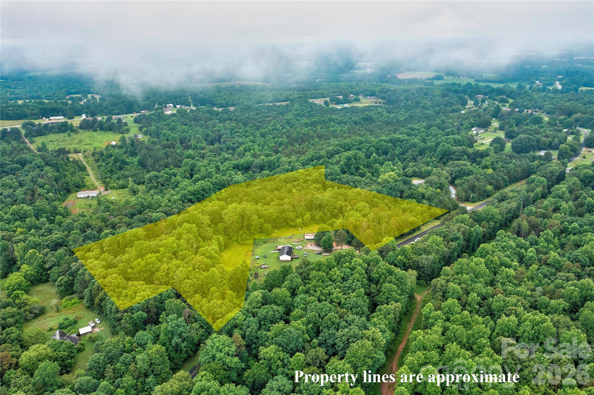 Enjoy rural seclusion on 15.28 wooded acres of land in the heart of Cleveland County, NC. Perfectly positioned for potential residential development or agricultural use, this expansive property offers the natural beauty of mature trees and privacy, while still providing access to essential infrastructure — including public sewer - with no restrictions and over 450 foot of road frontage. Located within a short drive to Tryon International Equestrian Center or an easy commute to Charlotte and surrounding cities. A beautiful property that offers a blend of seclusion and convenience in a quiet country setting! Parcel has new parcel number - 68118