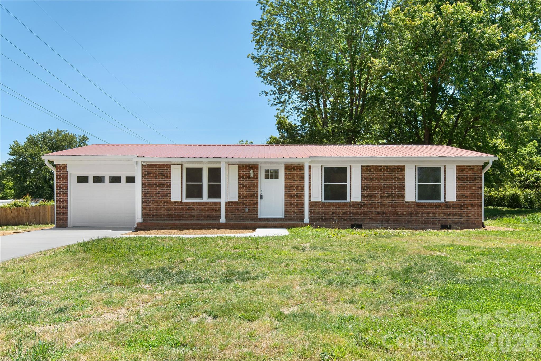 Welcome Home!
Imagine pulling into your own garage, stepping inside, and feeling instantly at ease. This sweet brick home in a prime central location — just minutes from downtown and shopping — has everything you need to simply move in and start living.

With three bedrooms, two full baths, and beautiful finished floors throughout, the space feels warm and ready to welcome you.

The kitchen is where this home truly shines. Picture yourself cooking and gathering around gorgeous granite countertops, with sleek stainless steel appliances that make everyday meals feel like something special. Whether you're brewing your morning coffee or hosting friends for dinner, this kitchen is the kind you'll actually love spending time in.

And the outside? Nearly effortless. Brick and vinyl siding plus a durable metal roof mean more time enjoying your home and less time maintaining it.

Definitely a rare find that won't stay on the market long!