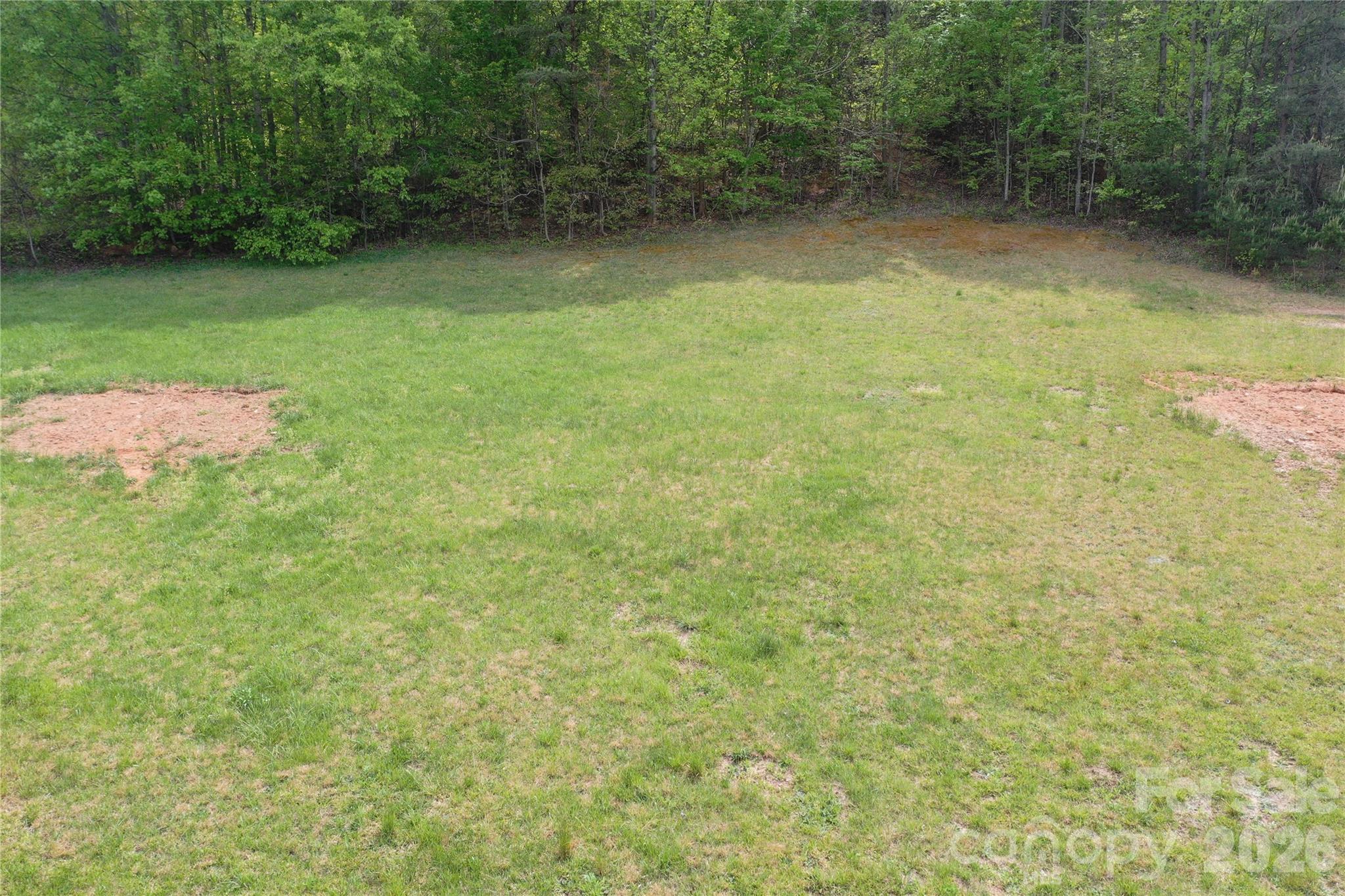 Discover this 0.89± acre tract in Connelly Springs, NC located within the established Kayla’s Ridge subdivision, offering a great mix of usability and convenience. The property is mostly cleared, providing a strong head start for a future homesite with minimal prep work needed, while still leaving room to shape the land to your vision. With road frontage already in place, access is straightforward and adds to the overall build-ready appeal. Whether you’re looking to build a private residence, secure a manageable piece of land as an investment, or hold for future development, this property offers flexibility in a quiet, rural setting. The manageable size makes it easy to maintain, while the surrounding area provides the peaceful atmosphere many buyers are seeking. Opportunities like this where usability, location, and access come together are getting harder to find in this part of Burke County.