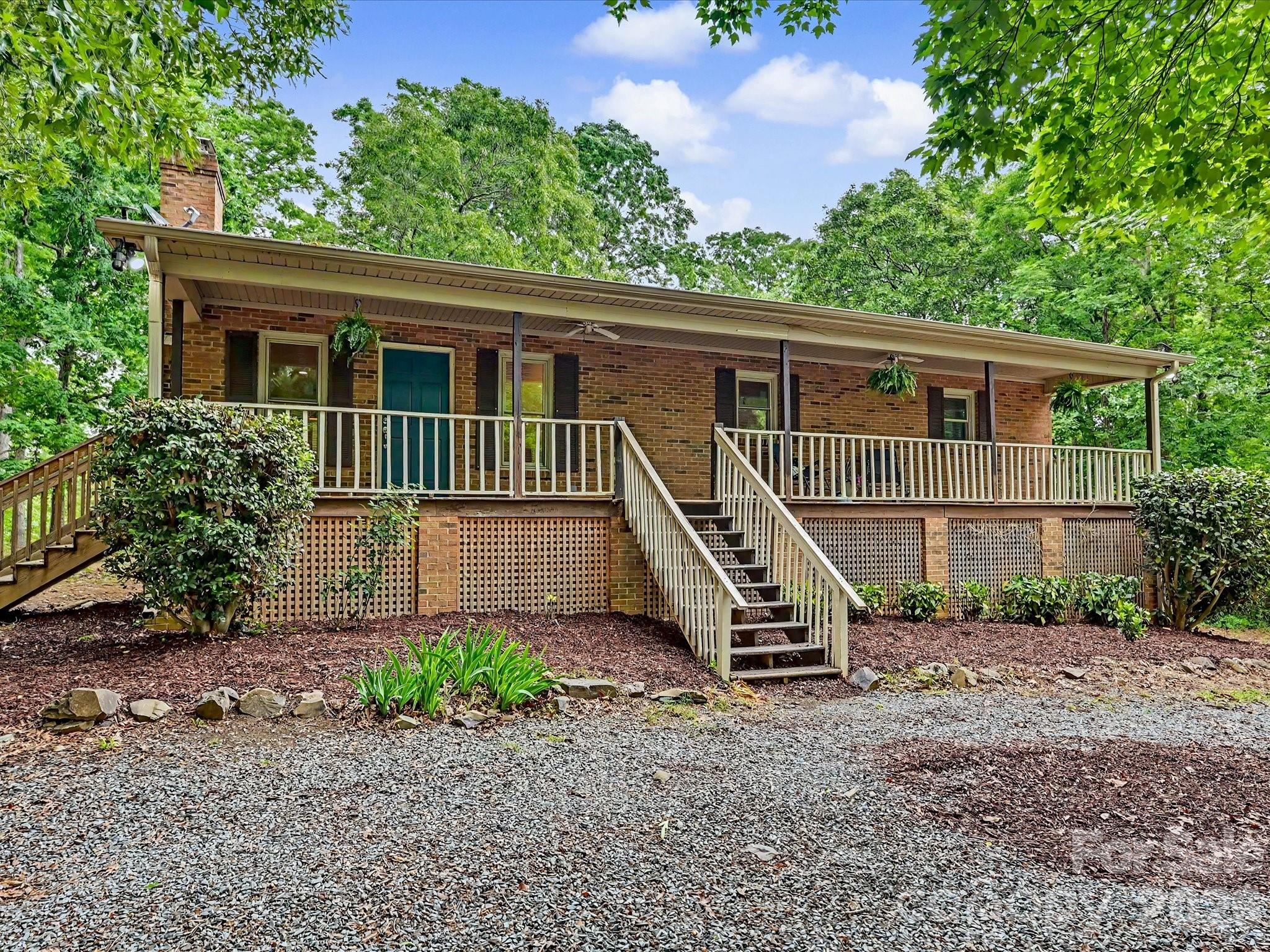 Welcome to your private slice of country living—where charm, space, and opportunity come together on 28 beautiful acres. This classic brick home greets you with a large, inviting front porch—perfect for morning coffee, evening sunsets, and everything in between.

The property offers a versatile mix of open land and mature wooded areas, creating the ideal setting for farming, recreation, or bringing your equestrian dreams to life. Whether you envision pastures, trails, or simply enjoying the peace and privacy, this land delivers.

Inside, you’ll find a warm and functional layout featuring durable LVP flooring throughout and a cozy fireplace anchoring the living room. The home includes 3 bedrooms and 3 full bathrooms, offering comfortable space for family and guests. Kitchen complete with kitchen island with an overhang perfect for bar stools, and custom tiled backsplash, and open floorplan into the dining area and living room.

The finished 700-square-foot walk-out basement provides additional living or flex space—perfect for a home office, recreation room, or guest suite—with easy access to the outdoors with added peace of mind from French drains installed around the basement. Enjoy the outdoors year-round with both a screened-in back porch and an open back porch—ideal for relaxing or entertaining while overlooking your expansive property. 

Outside, the possibilities continue with an oversized 1,200+ square foot tractor barn with electricity and an additional 520 square foot shed, also with electricity, perfect for a workshop, storage, or hobby space.

Tucked away yet conveniently located just minutes from town and bypass, this property offers the rare balance of seclusion and accessibility. Whether you're looking to expand, homestead, or simply enjoy room to roam, this one has the potential to make it all happen.