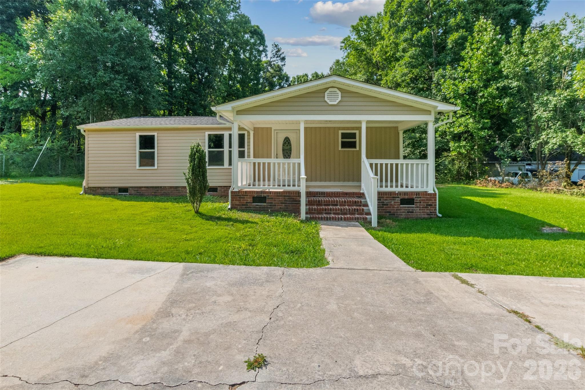 Welcome home to this beautifully updated 3-bedroom, 2-bath manufactured home situated on an almost half-acre lot, offering plenty of outdoor space to enjoy. Inside, you'll find a bright, inviting layout featuring new interior doors, updated lighting, and a brand-new HVAC system for year-round comfort. The kitchen is both stylish and functional with granite countertops, ample cabinet space, and a convenient pantry. The home's new vinyl siding and roof adds lasting curb appeal and low-maintenance durability. Whether you're a first-time homebuyer, looking to downsize, or searching for an investment opportunity, this move-in-ready home offers comfort, value, and room to make it your own. The seller will install a stove prior to closing.