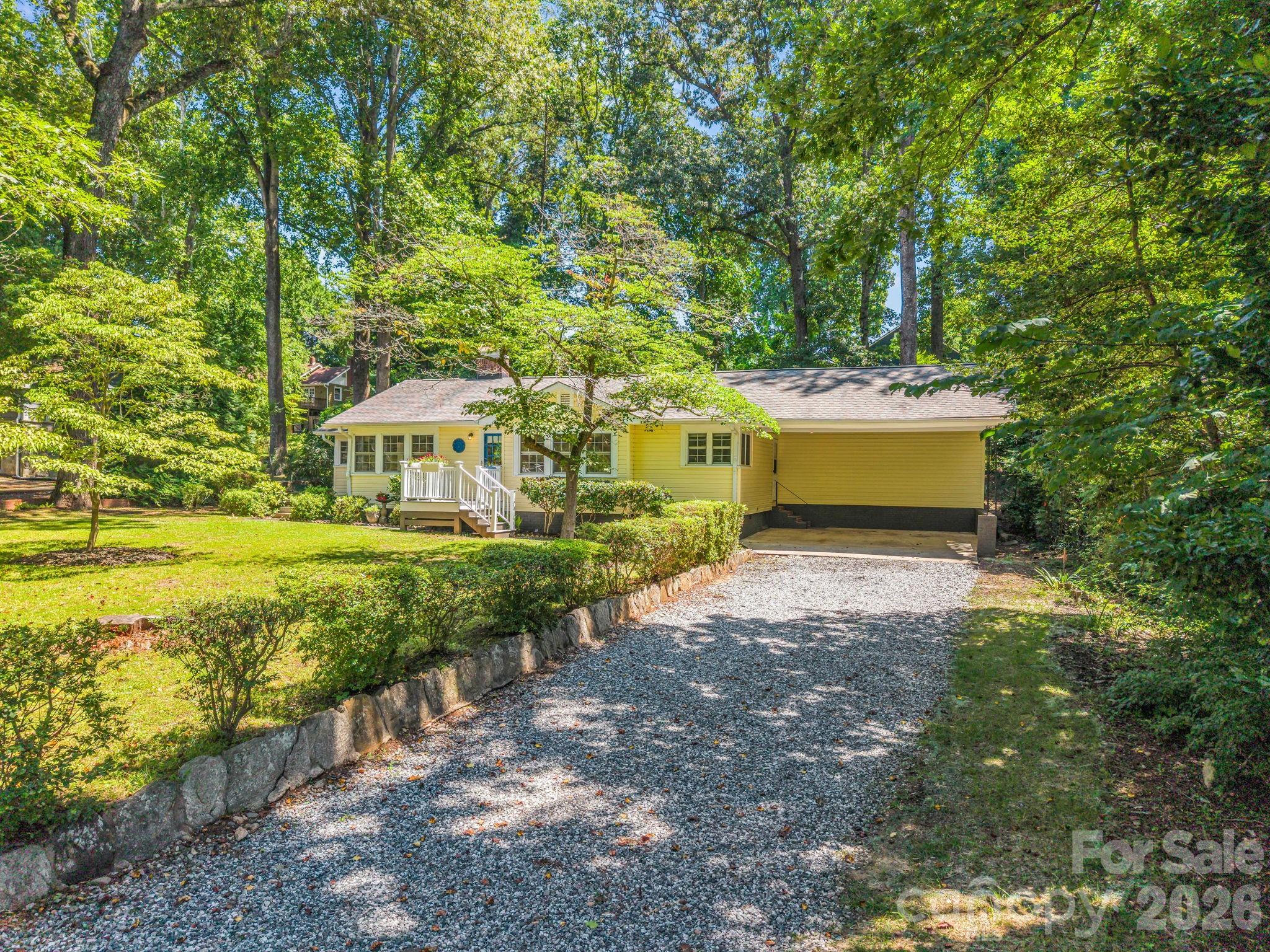 Classic charm meets modern comfort in this beautifully updated 1944 home, ideally situated on a level 0.34-acre lot just minutes from the heart of downtown Tryon.
Offering 3 bedrooms, 2 baths, and 1,476 heated square feet, this inviting home features a desirable split-bedroom floor plan that provides privacy for the primary suite while maintaining comfortable gathering spaces for family and guests. The remodeled kitchen is the centerpiece of the home, opening to a spacious new screened porch, creating an inviting indoor-outdoor living space for entertaining or simply enjoying the mature trees and peaceful surroundings.
The original character has been thoughtfully preserved, with beautifully refinished hardwood floors, while numerous recent improvements provide peace of mind. Recent updates include a new natural gas furnace and central air system, renovated kitchen, updated plumbing, refinished hardwood floors, an enclosed screened porch, drainage improvements, and many other thoughtful enhancements completed over the past few years.
Outside, you'll find a side patio, mature shade trees, and a level backyard with plenty of room for gardening, outdoor entertaining, or simply enjoying the peaceful setting. An attached two-car carport and an outbuilding provide excellent parking and storage options.
The home also includes a walk-up attic for convenient storage and a 617-square-foot unfinished basement housing the mechanical systems and providing additional storage space.
Located on city water and sewer with natural gas service, this move-in-ready home offers the perfect blend of timeless character, modern updates, and an exceptional location just minutes from downtown Tryon's restaurants, galleries, theatres, parks, and community events. If you've been looking for an updated home with classic appeal in one of Tryon's most established neighborhoods, this property is well worth a visit.