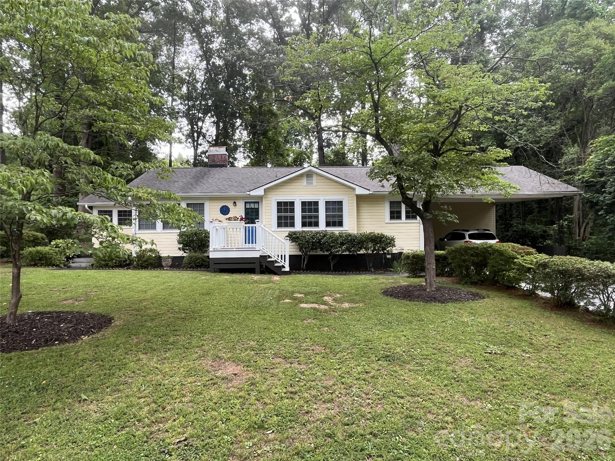 Coming Soon! Classic charm meets modern comfort in this beautifully updated 1944 home, ideally situated on a level 0.34-acre lot just minutes from the heart of downtown Tryon.
Offering 3 bedrooms, 2 baths, and 1,476 heated square feet, this inviting home features a desirable split-bedroom floor plan that provides privacy for the primary suite while maintaining comfortable gathering spaces for family and guests. The remodeled kitchen is the centerpiece of the home, opening to a spacious new screened porch, creating an inviting indoor-outdoor living space for entertaining or simply enjoying the mature trees and peaceful surroundings.
The original character has been thoughtfully preserved, with beautifully refinished hardwood floors, while numerous recent improvements provide peace of mind. Recent updates include a new natural gas furnace and central air system, renovated kitchen, updated plumbing, refinished hardwood floors, an enclosed screened porch, drainage improvements, and many other thoughtful enhancements completed over the past few years.
Outside, you'll find a side patio, mature shade trees, and a level backyard with plenty of room for gardening, outdoor entertaining, or simply enjoying the peaceful setting. An attached two-car carport and an outbuilding provide excellent parking and storage options.
The home also includes a walk-up attic for convenient storage and a 617-square-foot unfinished basement housing the mechanical systems and providing additional storage space.
Located on city water and sewer with natural gas service, this move-in-ready home offers the perfect blend of timeless character, modern updates, and an exceptional location just minutes from downtown Tryon's restaurants, galleries, theatres, parks, and community events. If you've been looking for an updated home with classic appeal in one of Tryon's most established neighborhoods, this property is well worth a visit. Professional photos coming on July 17.
