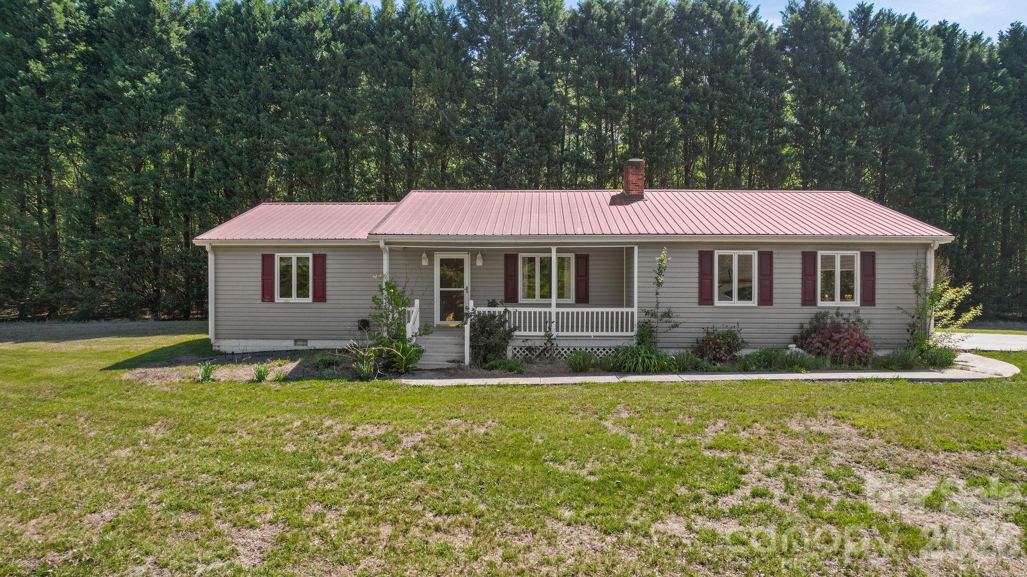 Home with 32+ acres! Come see this 2BR/2BA home tucked back off New Salem Rd. in beautiful Cool Spring community with over 32 acres of land, buildings, views and more. Cozy home is just over 1100 sq/ft with rocking chair front porch views of the fishing ponds on adjoining property. You'll enter the heart of the home, a large living room with plenty of space to spread out, wood burning fireplace with propane gas line and picture window water views. Your kitchen sits in the back of the home and spills out onto the covered back porch. The land is the real gem here. Three parcels to convey for a total of over 32 acres. The large parcel behind 40x30 metal building with 16' dry overhang is primarily cleared with wooded areas along the rear property lines.  Gently sloping and easily walkable. Land would be a great place to build your forever home or fence multiple acres for pasture. Property also features a 28x28 metal building on the north end of the parcel containing the home. This property is located off Pops Lake Rd. which will convey with this sale.  Pops Lake Rd. is privately maintained and contains easement for adjoining properties use. Shared well situated on the parcel with the home and shares water for residential purposes with neighbor. Property abuts active commercial fishing ponds. Come and see this great property before it's gone!