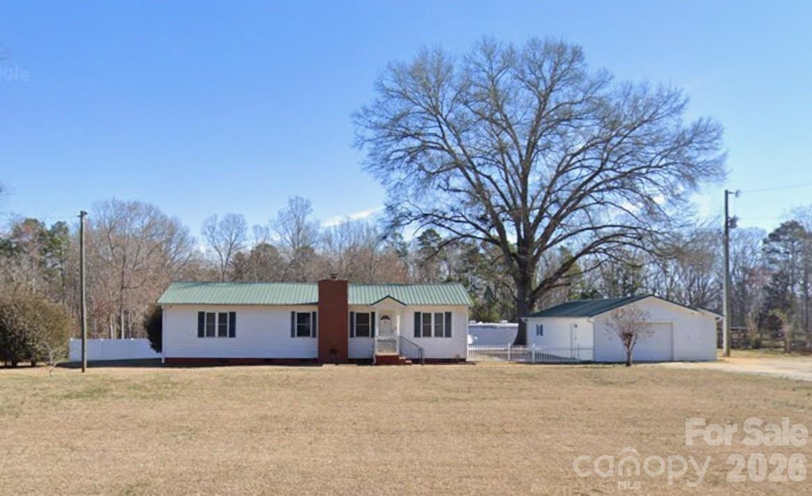 Tucked away in the quiet countryside of Rock Hill. this inviting 3-bedroom, 2-bath home offers the kind of space and layout that just works. The open floor plan flows effortlessly, with a kitchen that features a functional island and breakfast bar overlooking the living and dining areas, all highlighted by a vaulted ceiling that adds to the sense of openness.

The living room centers around a cozy gas-log fireplace, perfect for winding down at the end of the day. Step outside to a spacious covered deck made for both entertaining and enjoying a little peace and privacy, with partial fencing already in place.

Car lovers, hobbyists, or anyone tired of fighting for garage space will appreciate the massive 975 sq ft garage, fully wired and ready to go. Add your own personal touch and you’ve got a property that delivers comfort, function, and a little breathing room from the chaos of everything else.