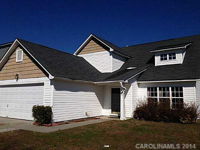 Spacious two story home with master bedroom on main. Open floor plan with vaulted ceiling, two bedrooms upstairs with loft. Large backyard with wooded area. Home being sold "as-is, where-is."