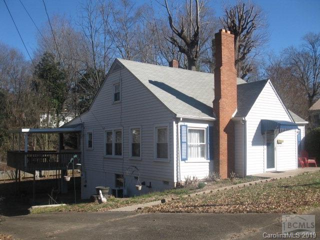 Nice bungalow in Morganton. Home, with over 1450 square feet, features living room with fireplace, formal dining room, kitchen/dining, three bedrooms, 1 bath, deck, and partial basement. Updates include laminate floors, gas heat, and central air. Situated on 0.40 acre lot with nice backyard. Forest Hill school district.